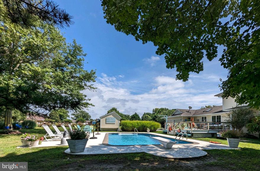 This "Coming Soon" home is Awesome!  It went thru a major rebuild in 2008 that included the addition of the second floor.   This home offers the perfect blend of architecture and light.  Such an inviting atmosphere for entertaining or simply relaxing.  Gorgeous hardwood floors run throughout most of the main level.  Well thought-out floor plan offers family room with gas fireplace, updated kitchen with bar seating and plenty of dining area space.  The main level also has a charming sun room, an office and a lovely in-law suite with separate entrance!  This suite provides a small kitchen, living room, bedroom and a full bath. It could be that additional space you seek and offers potential for many uses.  Upstairs are 3 additional bedrooms including the Primary with full bath. This home offers so much I almost forgot the fabulous water views from many different rooms.  Enjoy the in ground pool, it is skirted by mature trees for privacy. There is a gas connection at the deck for your barbecue.  Attached 2 car garage, enormous driveway,  a very useful shed.  All perfectly situated on a 1 acre corner lot facing Eastern Bay and glorious sunsets!  Located in the water privileged community of Prospect Bay Golf and Country Club.