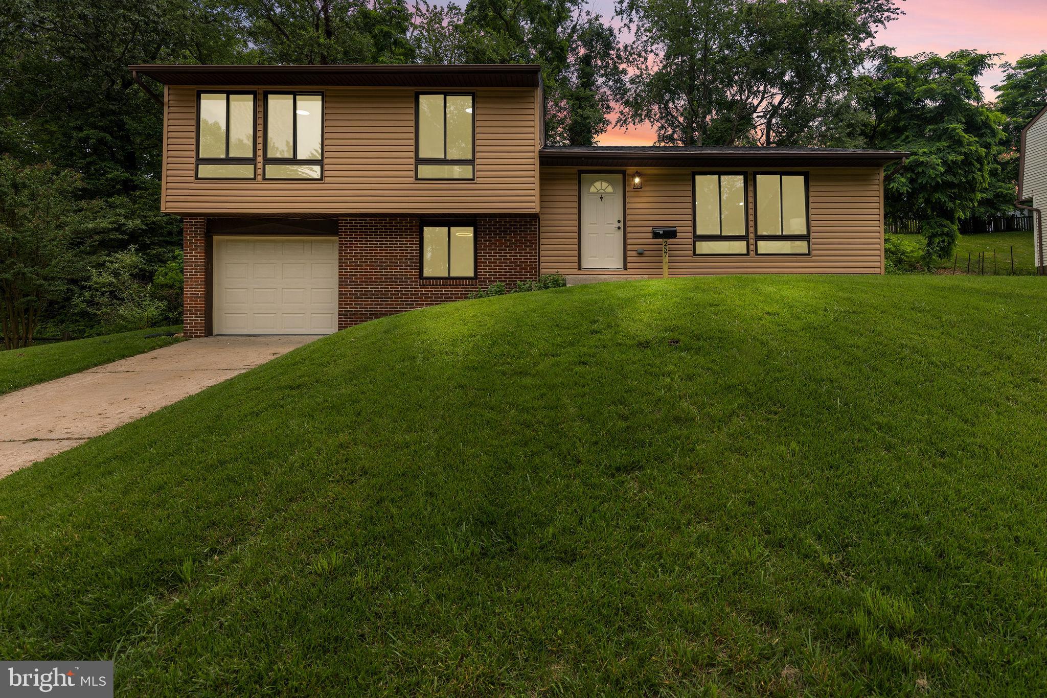 This stunning 4-bedroom, 2 full bath single-family home has been fully renovated from top to bottom, offering modern style and comfort throughout. The open floor concept and high ceilings create a spacious and inviting atmosphere, perfect for both everyday living and entertaining guests. With multiple living room areas, there’s plenty of space for relaxation, gatherings, or a home office setup. The sleek, updated kitchen flows seamlessly into the main living areas, enhancing the home’s bright and airy feel. Outside, you'll find a large deck overlooking the backyard—ideal for outdoor dining, barbecues, or simply enjoying the fresh air. Completing the home is a convenient one-car garage, adding both functionality and storage. This move-in-ready gem is perfect for anyone looking for space, style, and modern living.
