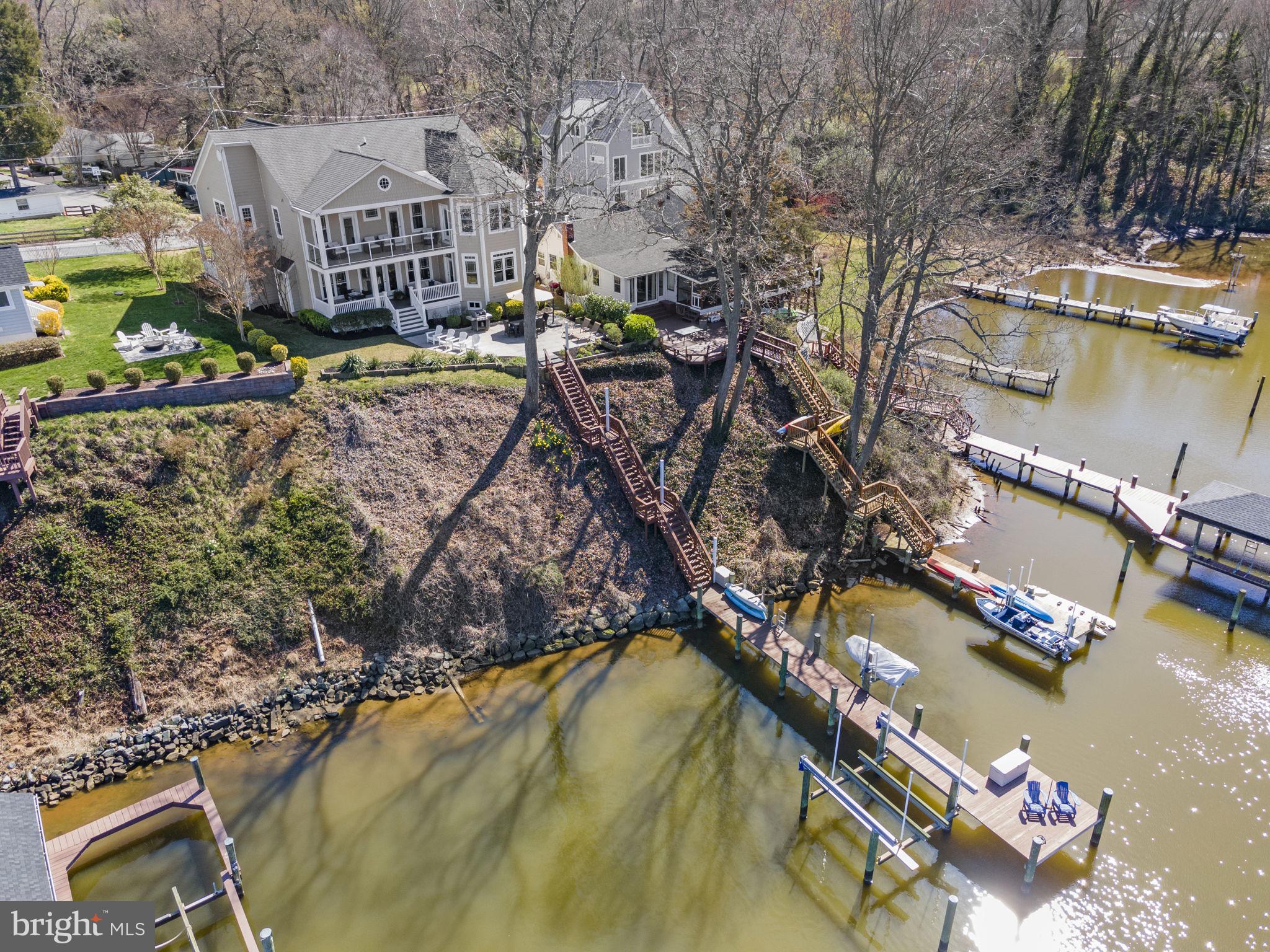 IMPECCABLE home on the South River to satisfy the lifestyles of the waterfront enthusiast and avid entertainer, offering resort-style living as soon as you walk through the front door. This home sits west-facing on a private cove off of the South River, with no thru-boat traffic, a short distance to the access point to the main channel, and a protected shoreline from the wakes of powered watercraft. The 60-feet of water frontage allows for wide water views from the two levels of expansive decking. This beautiful, solidly built custom home boasts high-quality craftsmanship and functional design for a ‘new construction’ feel, being built only 10 years ago. A new gas furnace was installed just a year ago, and the home is equipped with a whole-house generator. The large and open floor plan is accompanied by high ceilings and flooded with natural light from the span of windows surrounding the home. There is no lack of space for the family and to comfortably host guests, between the 5 spacious bedrooms and 4.5 luxurious baths that span from the lower to upper level, an open concept on the main level featuring a chefs kitchen with an oversized island and stainless steel appliances, and additional living space in the basement for movie and game nights. The primary suite faces the water and exudes luxury, featuring two expansive walk-in closets, an ensuite bath with separate vanities, a sleek step-in shower, and soaking tub, plus an attached space for a home gym or additional office space with access to the upper level balcony. The backyard is a great entertainment space for summer nights after long days on the water and fall bonfires on the patio. This incredible home is complimented by the waterfront community of Sylvan Shores, driven by its history, amenities, and proximity to nearby cities. Due to its scenic and advantageous waterfront location near the cultural and economic hubs of Baltimore, Annapolis, and Washington, D.C., Sylvan Shores has a storied local history. Further background can be read on their website - sylvanshoresriva.com. From the lively community to the meticulous details and features, this home is a ten-out-of-ten!