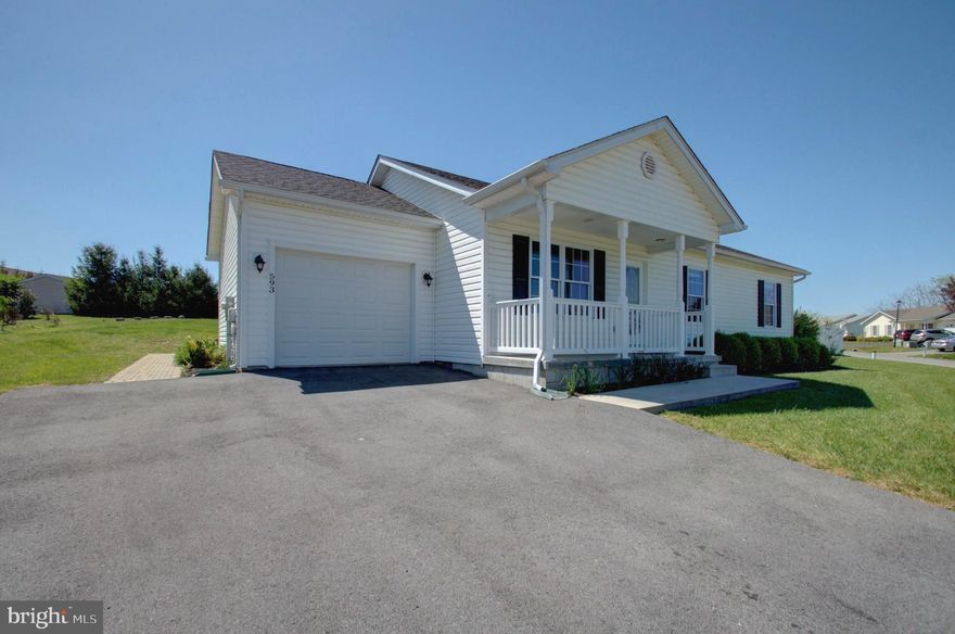 Located in the lovely neighborhood of The Vineyards, this rancher is move in ready. Situated on a spacious lot, enjoy the outdoors from a beautiful deck and patio or from your front porch. Inside, this home boasts all new flooring with LVP through out the living room, dining room and kitchen. All  new carpeting has been installed in each of the ample sized bedrooms. Plenty of closet space. Upgraded doors. Window blinds convey. Vaulted ceiling and windows create a sun filled living space. Located near shopping and dining. Come see this beautiful house and make it your home.