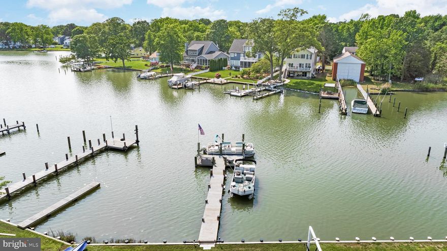 A Year Around Vacation Home, All Set-Up for Fun!!!  Just Bring Your Suitcase!!!  This Beautiful Coastal Contemporary Home Has it All!!!  Was just built in 2020.....What an Easy Move With Most Custom Furnishings Conveying  Except for Artwork and Primary Bedroom Furniture..   This Home Sits on the South Creek and offers a Private 60 Foot Pier with a 20 Foot Platform and Boat Slip.  View Gorgeous Sunsets from the South Creek to the West River. This Home Boasts an open floor plan with 3 bedrooms, 2 baths, and 1+ Car Garage, offering year round Water Views and access from most rooms.  The Great Room  with Gas Fire Place offers indoor/outdoor entertainment space with plenty of room for guests with 2 sliding glass doors that open up to the back deck.and patio. A maintenance free Deck complete with outside furniture and stone patio with fire pit make for the perfect evenings.  This Custom Built Home has 6 foot Windows, 4 Sliding Glass Doors, 9 Foot Ceilings and Wide Plank Oak Hardwood Floors throughout.  The Gourmet kitchen features Leather Granite counter tops, Black Stainless Appliances, Glass Backsplash, and a large 9 Foot Island with a Quartz Counter Top.  This Chef's Kitchen is adorned with a Double Oven, Drawer Microwave, Pot Filler, and Stainless  Vent Hood.  The Primary Bedroom offers Gorgeous Water Views and a Sliding Glass Door for your Private Water access. The Primary Bedroom has an Electric Fireplace for those chilly evenings, and an Ensuite with Marble Shower and Walk-In Closet.  Two additional bedrooms and tiled hall bath with tub are included in this one level living home.  Also included is a Sprinkler System, Security System and Water Filtration System.   Conveniently located to Marinas, Waterfront Restaurants "Pirates Cove, Skippers Pier, Stan & Joes Riverside," Chesapeake Yacht Club in Shady Side, West River Sailing Club and Golf Courses.   Easy access to  Annapolis and less than an hour from Washington, DC,  Regan National Airport, Baltimore and BWI Airport.  The Avalon Shores Community has Access to Community Boat Ramp, Park  and Playground.