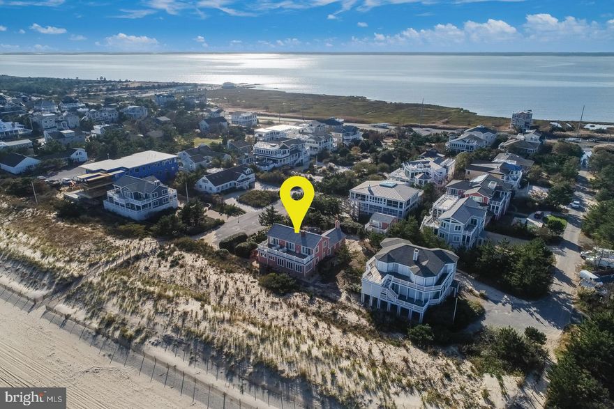 Rarely offered 5 bedroom, 4.5 bath oceanfront home, plus guest cottage, situated on an oversized 100' x 144' lot in the private community of Indian Beach. Take in the ocean breezes from every room of this classic spacious home and unwind on the private guarded beach. The first floor boasts a master bedroom with gas fireplace, two guest bedrooms, multiple living spaces, wet bar, and gourmet kitchen with granite counters, large island and stainless-steel appliances leading to an open dining area. Other charming features include a brick wood burning fireplace, original hardwood floors, terracotta tile, exposed beams, plank ceilings and an abundance of natural light. The second floor includes two additional master bedrooms and a living area with fireplace that showcases the ocean views. The exterior features a sprawling second floor sun deck overlooking the ocean, brick patio, rear deck with spa and outside shower. In addition, the detached guest cottage features 1 bedroom, 1 bath, living room and spacious sundeck above the 1 car garage. This home offers relaxed coastal living at its best in one of Rehoboth and Dewey Beach's most desired locations.
