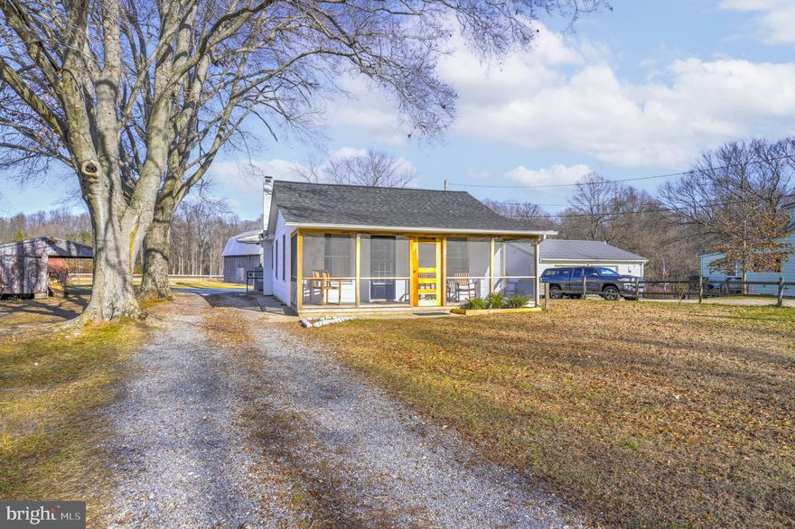 This adorable home is move-in ready and features beautiful wood floors and a spacious dining area that opens seamlessly to the living room. The home offers two comfortable bedrooms and a charming screened front porch—perfect for relaxing on lazy evenings. The rear yard boasts a concrete patio with peaceful views of open farmland. Additional highlights include two sheds and a partially unfinished basement with a workshop. This home offers a highly desirable and convenient location. Only about 20 mins to Andrews, 35 mins to Capitol Hill, about 30 mins to downtown Annapolis.