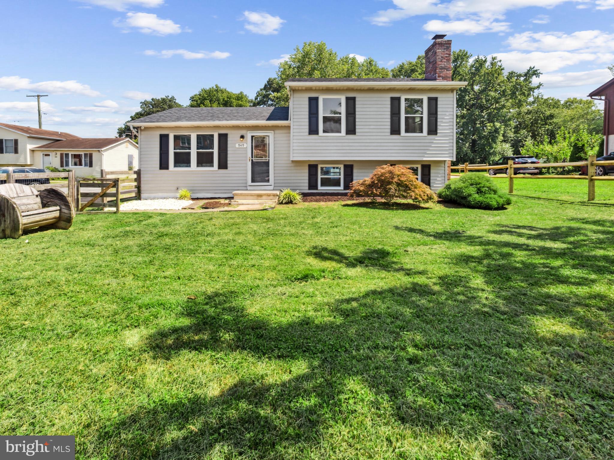 This spacious and thoughtfully updated split-foyer home offers multiple levels of living, comfort, and flexibility—perfect for entertaining, multigenerational living, or working from home. The upper level features two bright bedrooms and a full bath. Step down to the main living level, where you'll find a spacious living room and an eat-in kitchen that walks out to a covered rear deck—ideal for outdoor dining and gatherings. The next level offers a cozy family room with a fireplace, a third bedroom, and another full bathroom with dual entry access from both the bedroom and living space—perfect for guest or private use. The lowest level includes a dedicated laundry room, additional family or rec room, office area, and a convenient half bath. Enjoy exceptional outdoor amenities with a fully fenced private backyard featuring a built-in swimming pool, garden area, pool house for changing, and a rear shed for extra storage. The expansive driveway accommodates 6–7 vehicles, offering rare off-street parking flexibility. Conveniently located near shops, dining, and commuter routes—this home checks every box!
