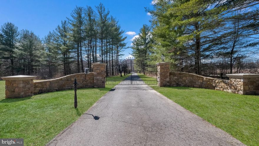 They say "location, location, location", but what about "privacy, privacy, privacy"? This 10 acre estate is truly the best of both worlds; all opportunity and no compromise. The true showcase of this property is the 3200SQFT pole barn that encompasses the ability to do anything.  Contractor, tradesman, car enthusiast, micro farmer, aspiring equestrian.. no matter your dreams, this fully outfitted pole barn is capable of making them come true; 6" concrete flooring, 200amp electric panel (separate from main home), automotive lift, a private 16' X 32' room that is insulated and ready for heat and air, built in air compressors.. and many more amenities. This home is situated in the beautiful New Britain Township and is the ideal mix of location AND privacy - something that does not come available often.  You enter through a custom crafted, iron gate that is finished with beautiful stone masonry and allows for secure entry through the automated key pad. This grand entry way is complete with brass carriage lamps on both stone columns - the gate is  complete with electric outlets for holiday decorating or your addition of fixtures. Start down the driveway and see the property open up into a sprawling estate that is filled with endless possibilities. This timeless manor home is the one of your dreams with original stucco and brick work, a covered stone porch, and beautiful hardscaping to complete the outside. This home has been pridefully owned and maintained which is evident by the immaculate interior. The eat-in kitchen is complete with granite countertops, a double oven, High end built-in countertop steamer with fill valve, drain, and ample counter space. Cozy up by the wood burning stove in the sunken entertainment area and watch a movie or open the sliding patio doors and spend the day in a backyard most will only dream of. The formal living area and dining area are Brazilian cherry hardwood floors that add another touch of elegance. The main level of the home is complete with a game room, first floor laundry and mudroom, two powder rooms, and access to the rear outdoor entertainment area. The second floor of the home has three generously sized bedrooms in addition to the master suite. The master has double entry doors and it's own private bathroom with marble countertops, dark cabinetry, double sinks, and a soaking tub. One of the additional bedrooms has a private balcony with custom wrought iron railings that looks out into the complete privacy of the woods. This home has a full basement that is fully carpeted with a large walk in storage closet, a sauna, and waterlines for easy installation of a wet bar, kitchenette, or additional laundry. But that's not all, this home has a gorgeous three car garage with 8' automatic doors. Above this space, there is an additional loft with three dormers and two skylights.. flexible space for whatever you wish. The grounds of this estate truly make it one of a kind. There is an above ground pool surrounded by Trex decking, a 6' deep fish pond wit h a lit fountain, two 12' X 20' sheds complete with electricity and lighting. There is a chicken coop with four laying hens if you wish. Contact agents for private showing or book through ShowingTime.