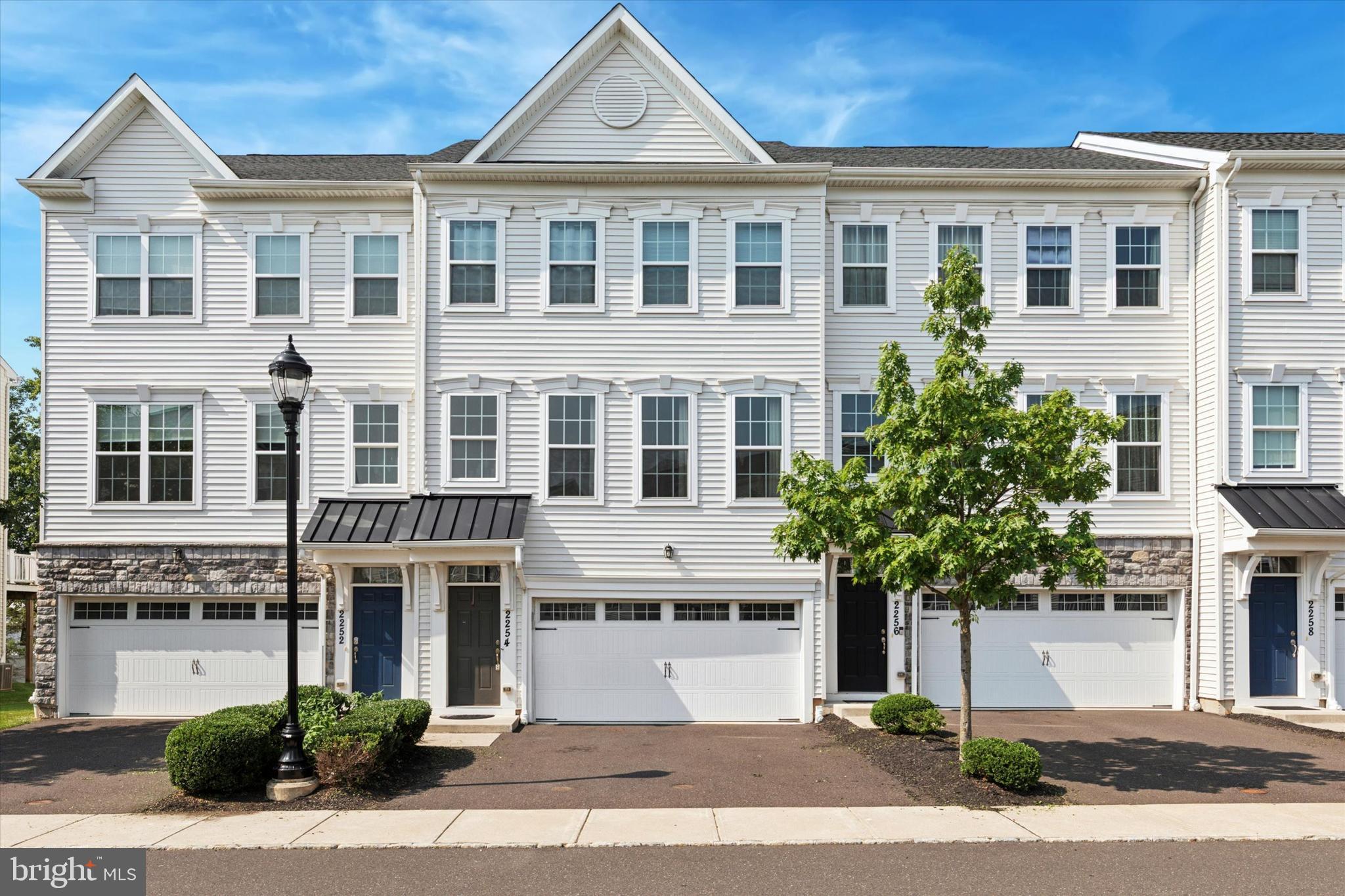 This 3 story Townhome is located in award winning Central Bucks School District. Offering 3 Bedrooms 2 1/2 baths and 2 car garage. Large kitchen, great/living room, powder room, dining room provide the open floor plan that everyone enjoys.
The kitchen leads to a private deck where you can enjoy your morning coffee or a summer meal. The kitchen offers an enormous granite island, which is perfect for entertaining, Dark cabinets with granite counters, and stainless steel appliances. Large and plentiful windows fill this space with natural lighting. The upper level includes a Master suite with his or hers walk in closets, and a luxurious Master bath with soaking tub, shower, and double vanity with granite counter top. Two additional bedrooms, hall bath with granite vanity top and laundry room completes the 2nd floor. The lower lever features a beautifully finished family room with laminate flooring. A sliding door leads to the rear of the home, and a large window lets in lots of natural sunlight. There is direct access to the 2 car garage on this level. Located just minutes from Valley Square shopping, Wegmans market and a short drive to the quaint towns of Doylestown, Peddlers Village and New Hope. Close to commuter routes of PA Turnpike, Route 202 to NJ and Rt 309 to the north.
