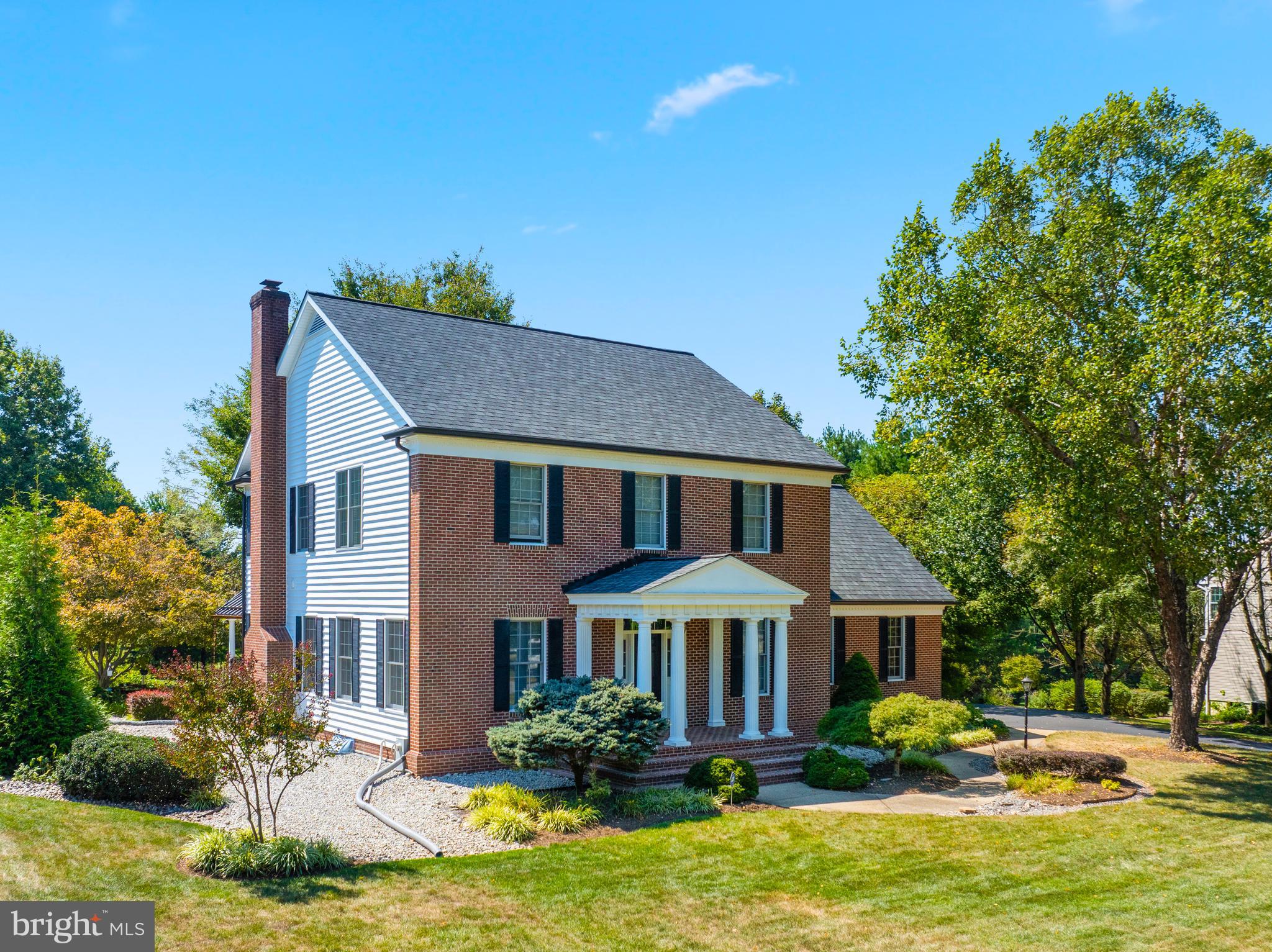 This gorgeous Southern Living home designed by architect William Poole offers over 3200+ square feet of finished area on the upper 2 floors, you will be amazed at all the space and rooms! The main level features a formal living and dining room perfect for entertaining, a spacious family room with a cozy wood-burning fireplace. The kitchen boasts beautiful cherry cabinetry, upgraded countertops, and a huge pantry. Gleaming hardwood floors flow throughout the home. Step outside from the family room to a unique gazebo-style porch with retractable screens, overlooking a meticulously manicured backyard and patio. The natural wooded fence line provides a serene, private backdrop. The unfinished lower level offers 1400+ square feet of endless possibilities with a full bathroom rough-in and an egress window for a future bedroom, plus convenient walk-up stairs to the yard. An oversized 2.5 car garage completes this exceptional property. Some updates in the last 4 years include, roof, driveway, water heater, well tank, washer/dryer, upstairs HVAC, siding, fascia, soffit, and gutters. Located in the Warfield's Grant neighborhood. Don't miss viewing this one!