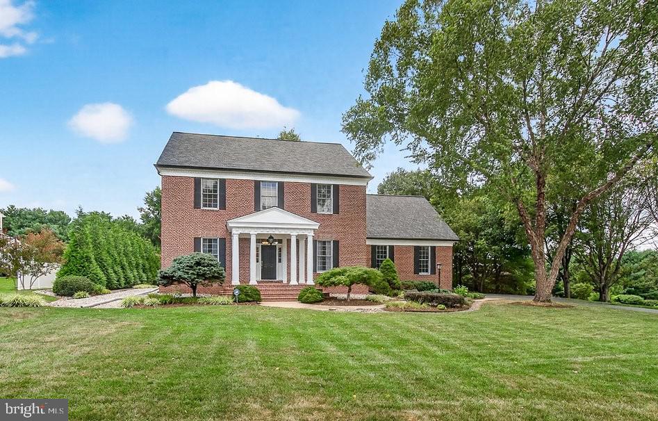 Welcome to your dream home in the Warfields Grant community! This stunning colonial exudes "Southern Living at its finest." The main level features a formal living and dining room perfect for entertaining, a spacious family room with a cozy wood-burning fireplace. The kitchen boasts beautiful cherry cabinetry, upgraded countertops, and a huge pantry. Gleaming hardwood floors flow throughout the home. Step outside from the family room to a unique gazebo-style porch with retractable screens, overlooking a meticulously manicured backyard and patio. The natural wooded fence line provides a serene, private backdrop. The unfinished lower level offers endless possibilities with a full bathroom rough-in and an egress window for a future bedroom, plus convenient walk-up stairs to the yard. An oversized 2.5 car garage completes this exceptional property. Don't miss this one!