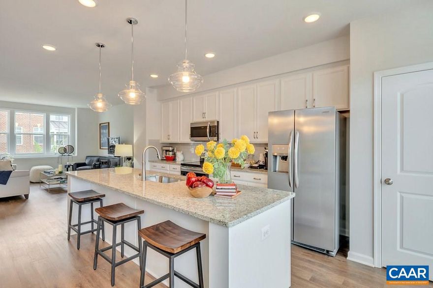 Located just minutes from the Downtown Mall, this home offers beautiful, designer inspired finishes. The effortlessly open floorplan has a spacious galley kitchen which leads to an outdoor deck that is perfect for an evening of entertaining friends and family. Soak up the Carter?s Mountain views from the rooftop terrace or while playing with your dog in the neighborhood dog park. Enjoy a weekend complete with a dinner and a movie at 5th St. Station, conveniently only a mile away! Summer 2019 Completion. Similar photos.,Granite Counter,Maple Cabinets