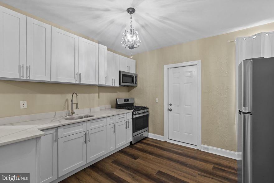 Welcome to this beautifully updated end-of-group brick townhome located in the Madison-Eastend neighborhood of Baltimore City! This home blends modern finishes with classic charm and offers easy access to everything city living has to offer.
Step inside to find a spacious separate living room, a convenient main-level half bath, and an open kitchen-dining combo perfect for entertaining or casual meals. The kitchen features new stainless steel appliances to include a stove, range and microwave.
Upstairs, you’ll find three comfortably-sized bedrooms, all with LVP flooring for a clean, stylish look. A carpeted staircase adds a cozy touch as you head to the upper level. The home also features central air to keep you cool and comfortable all year round. Outside, street parking is available and the newly fenced-in yard offers an opportunity to create your own outdoor retreat.
This beautiful home is just minutes to Johns Hopkins Hospital, Northeast Market, Clifton Park, and Patterson Park and close to shopping and essentials at Erdman Shopping Center. In addition, you have quick access to I-895, I-95, and Route 40 for an easy commute.
This is a fantastic opportunity to own a home near Baltimore’s vibrant heart. Whether you're a first-time buyer, investor, or city enthusiast—925 North Belnord Avenue is ready to welcome you home.