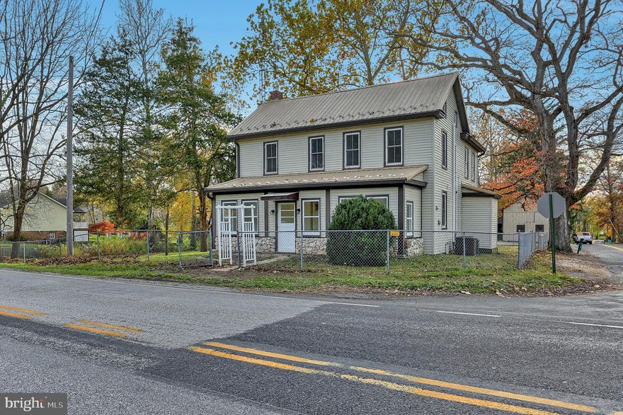 Newly remodeled spacious 4 BR/2 bath 2 story home on 3/4 of an acre.  You will love the high ceilings in this house and the large kitchen with white kitchen cabinets, brand new stainless appliances, and a huge walk-in pantry!  Spacious living room,  enclosed front and side porches, lots of closets,  and a bedroom and full bath on the 1st floor.  Upstairs you will find 3 large bedrooms, a brand new full bath and a newly remodeled balcony to enjoy your morning coffee.  Most of the floors are new vinyl planks.  A walk-up attic provides wonderful storage.   Dual heat and central air units. Low maintenance exterior with vinyl siding and vinyl windows and a metal roof.  Newly remodeled side porch.  Partially fenced yard.   Public water and sewer plus and auxiliary well on the property.