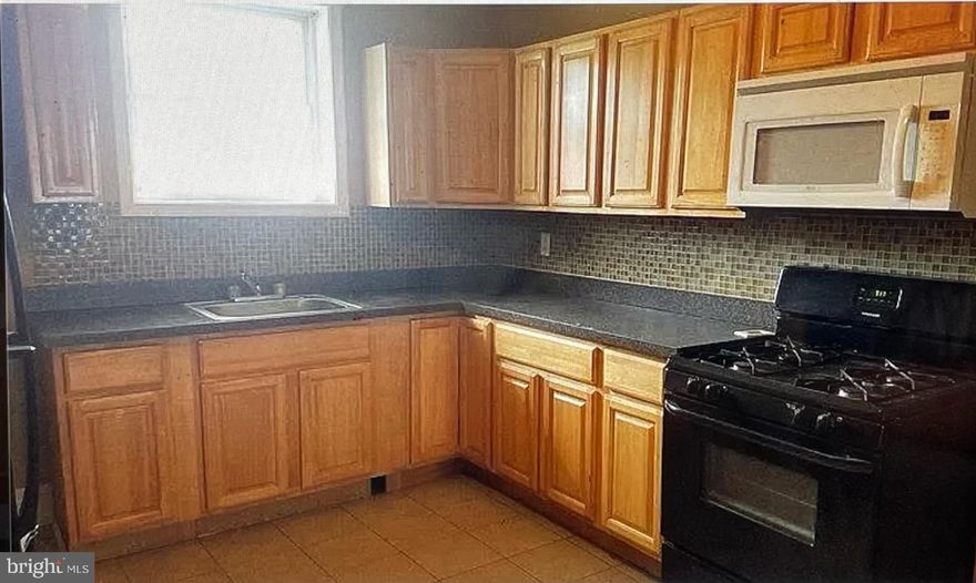 Investor and Home Buyer Alert! For Sale,  occupied and fully licensed income producing property to start your investment property portfolio business or if you are already established as an investor you can purchase this home and add it to your growing inventory list of investment properties. The property has been professionally managed by RPM of Maryland Inc from the get go and they are willing to continue servicing you the new buyer and your tenants. Home buyers although the home is currently occupied with a lease in place don't be afraid to tour the property with your agent. We can always work something out if you're interested in the location and property. This property has 2 new venting skylights, newer roof system as well a new cinderblock rear privacy wall.  Assistance program pays $944.00 per month and the  tenant pays $58.00 per month. Water bills average $50-$60.00 per month. There is a Partially finished basement, Central AC system with Rear Yard and concrete Slab along with a New Cinder Block Wall
New sump pump and French drain at rear wall in basement and New Skylight installed in 2019. Long time tenant since 2017.