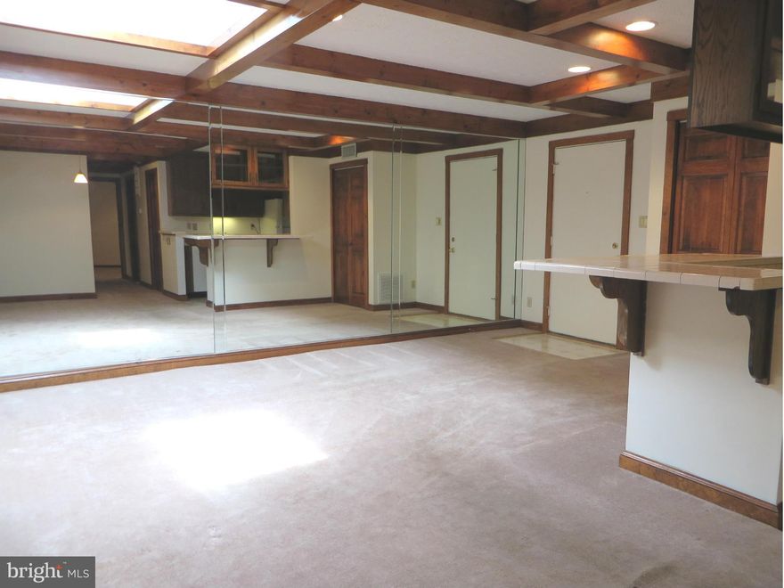 Unique features make this one special! Top-floor condo w/open KT has ceramic tile, wood ceiling beams, skylight, pocket doors, custom wood panels & mirror wall in the LR. MBR w/2 big closets, 2nd BR w/laminate floor. Full bath w/ceramic tile; laundry/storage rm. Condo fee inc water/sewer, trash, snow removal, ext maintenance, grounds care. Neighborhood walk/jog lanes, rec field, pool memb avail!