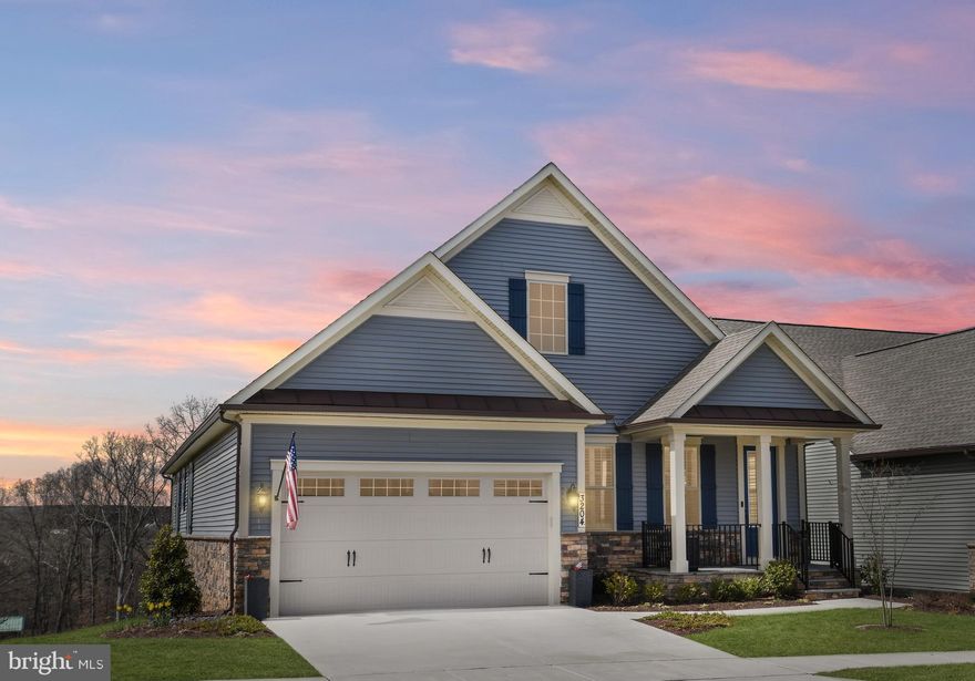 Welcome to The Woodlands, Urbana Maryland's most coveted 55+ community! This stunning home is nestled on a beautiful lot that backs to a peaceful wooded greenspace, providing a serene and private retreat for you to relax and unwind.

As you step inside this magnificent home, you'll immediately notice the impeccable attention to detail and luxury finishes throughout. The family room in this stunning home is a true gem---featuring a spacious light-filled open floorplan, and an elegant tray ceiling that adds a touch of luxury and sophistication to the space. Whether you're looking to unwind after a long day or spend quality time with loved ones, this room provides the perfect setting for relaxation and comfort.

The family room opens up to a covered porch, providing the perfect spot to enjoy your morning coffee or relax in the evening while enjoying the breathtaking sunsets and taking in the serene surroundings.

The upgraded kitchen is a chef's dream, featuring sparkling quartz counters, pristine white cabinets, and upgraded stainless steel appliances. Whether you're hosting a dinner party or simply enjoying a cup of coffee, this kitchen is the perfect place to gather and make memories.

The first floor boasts a primary bedroom suite with spacious dual vanity, granite counters, and a stunning shower complete with a bench and dual shower head -- the perfect oasis to start and end your day.

The primary bedroom also features two spacious walk-in closets and a tray ceiling, offering a luxurious and inviting space to rest and recharge. Additionally, the first floor includes a study/living area, a second bedroom, and a full bathroom--providing ample space for guests and family.

Downstairs, the lower level is an entertainer's paradise--complete with a spacious living and recreation area--great for watching movies, playing games or relaxing! Walk out from the lower level to the rear yard. All this, plus an additional bedroom and full bathroom as well as an extra-large storage area.  With a rough-in for a wet bar and plenty of space for entertaining, this lower level is the perfect spot to host friends and family.

Living in The Woodlands means you're not only getting an incredible home but also a fantastic community with unmatched amenities. The neighborhood is conveniently located near all of the great features of Urbana, including a Market Center with a grocery store, restaurants, the library, and senior center, doctor’s offices, and multiple parks-- making it easy to enjoy everything the area has to offer.

The amenities within the neighborhood are truly exceptional--and include a pool, fantastic clubhouse with a billiards and poker room, extensive gym, yoga/exercise studio, golf simulator, and meeting rooms for the myriad of community activities. Plus, you can enjoy walking trails, pickleball, bocce courts, an herb garden, and putting green! The community is extremely active, and there are plenty of activities to keep you busy. Whether it's joining the coffee club for a morning chat, playing pickleball with friends, attending seminars, or taking part in other activities, you'll always have something to do. The Woodlands is the perfect place to meet new friends, enjoy an active lifestyle, and create lasting memories. 

One of the best perks of living in The Woodlands is that you can spend your time doing what you love instead of worrying about maintaining your lawn, mulching, or shoveling snow. The HOA takes care of all of that, so you can focus on enjoying your free time.

Don't miss your chance to experience the incredible amenities and active lifestyle of The Woodlands - schedule your showing today!