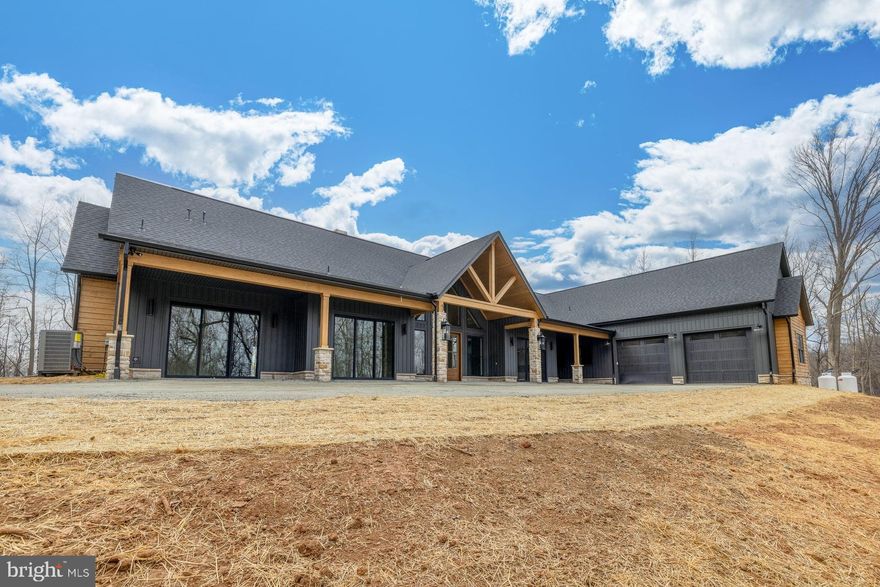 This extraordinary Albemarle estate is FULLY COMPLETED and READY for you--an exceptional, once-in-a-lifetime opportunity in the prestigious Blandemar Estates subdivision. Set on 24 private acres, this remarkable property captures sweeping PANORAMIC views of gorgeous trees and the breathtaking Blue Ridge Mountains. Offering 4,806 square feet on a rare, flat homesite, the residence is designed for effortless one-level living with five spacious bedrooms and four beautifully appointed bathrooms. A gently flowing creek traces the edge of the property, enhancing the sense of privacy and tranquility.

Inside, every detail reflects uncompromising quality and thoughtful design. The gourmet kitchen is a true centerpiece, featuring panelized appliances, floor-to-ceiling custom cabinetry, and an expansive walk-in pantry. Soaring vaulted and tray ceilings, custom-stained plank ceilings, and a seamless open-concept layout create an impressive yet inviting living space. Designed for elevated living and unforgettable entertaining, the home features a dedicated wine area with 300-bottle built-in coolers, a wet bar with sink and kegerator, and a sophisticated lounge anchored by a fireplace. The private primary suite wing offers a luxurious retreat, while a separate full guest suite ensures comfort and privacy for visitors. A fitness room, sauna or hot tub connection, and outdoor shower further enhance the lifestyle experience. Step outside to expansive covered porches with fireplaces--perfect for year-round enjoyment of the mountain views and peaceful surroundings. An EV charger and meticulous craftsmanship throughout complete this exceptional offering. The bathrooms rival a luxury spa, with fully tiled showers and a stunning primary bath featuring a rain shower and freestanding soaking tub. Want to share in the luxury? The seller has available plans for an additional guest cottage, while this would be additional, the seller will assist in coordinating this build for you outside of closing- for your ease and convenience. This is not only the home of a lifetime, this is the home of YOUR lifetime whether for personal use or as an investment AirBnB rental home. Includes approximately 3,800 square feet of conditioned living space and 1,006 square feet of covered porch living. Buyers and buyer's agents to independently verify all property information.