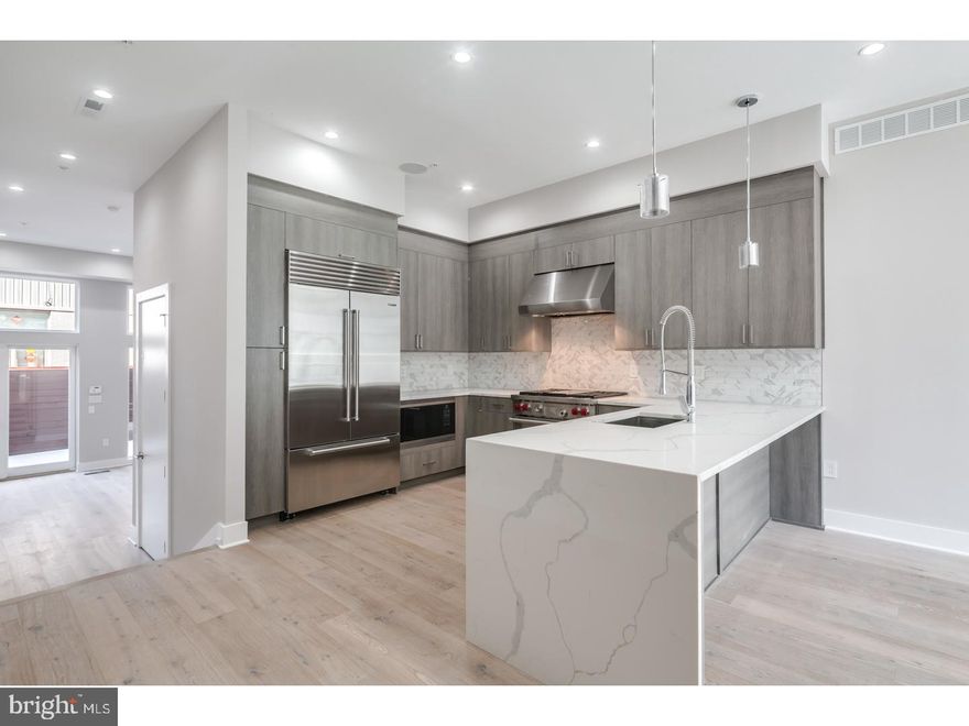 Double wide new construction at the best location within Bella Vista, in The Meredith School Catchment!! 4000+ square foot new home, with ELEVATOR, 3 decks including HUGE roof deck, PARKING, Tax Abatement and top of the line finishes. Four bedrooms plus a media room,  Exquisite Amenities include, Energy efficient dual hvac systems ? Security alarm with 2 keypads ? Video intercom system & home automation system ? 8' Solid core interior doors ? Metal handrails/railings on stairs ? Wood stairs with stained risers and treads, PARKING, 10-year tax abatement's pending, extra large Marvin windows with great views, Media room, exquisite Kitchens with Granite or Quartz counter tops ? Stainless steel appliances: - counter depth refrigerator - Sub Zero dishwasher - Bosch microwave - Bosch gas range - Wolf vent hood with light package - Wolf stove/oven ? Remarkable design features and much, much more! Located in an ultra-desirable neighborhood within the Meredith School Catchment (avoiding the need for Private Schooling), one of the most valuable property locations in Philadelphia ? this one's a no brainer. Built by Center City Philadelphia's #1 Home builder. STILL TIME TO CUSTOMIZE BUT THE WINDOW IS CLOSING FAST!! DELIVERY August 2017. Home is being sheet-rocked soon, so do not hesitate. Schedule a walk-through today! The pictures are of the builders similar project not of 711 Bainbridge.