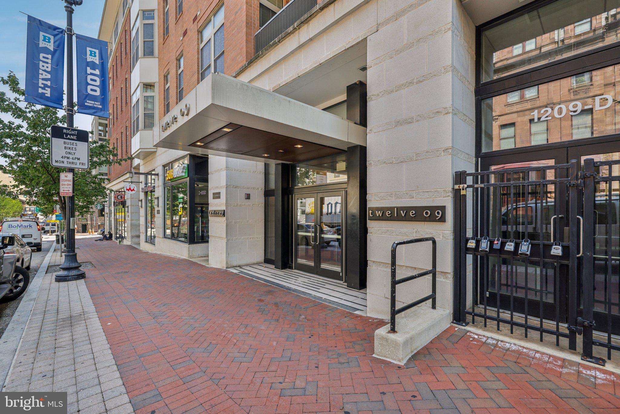 Experience upscale city living in the heart of Baltimore’s historic Midtown at 1209 N Charles St, Unit 409! This unique spacious 1-bedroom, 1-bath penthouse condo is located in the sought-after Twelve09 Condominiums, offering the perfect blend of modern luxury and urban convenience.
Step inside to discover an open-concept layout flooded with natural light, high ceilings, and sleek hardwood floors throughout. The gourmet kitchen is a chef’s dream, featuring granite countertops, stainless steel appliances, custom cabinetry, and a breakfast bar perfect for entertaining. The generously sized living area flows seamlessly to a private balcony, providing cinematic city views.
The large bedroom includes a master closet with high end built in shelving, and access to a contemporary full bath with premium finishes. In-unit laundry, central air, and plenty of storage complete the comfort and functionality of this stylish home.
But the true highlight is the building's top-tier amenities. Enjoy a fully-equipped fitness center, a personal expansive rooftop terrace with panoramic skyline views, a private resident courtyard with a fountain and fireplace, and secure garage parking. Pet-friendly and ideally located just steps from Penn Station, MICA, the University of Baltimore, restaurants, theaters, cafes, and all that Mount Vernon has to offer—this unit is a commuter’s dream with easy access to Amtrak, MARC, and major highways.
Penthouse units in this building are rare and do not come up very often, so don’t miss your opportunity to live in one of Baltimore’s premier condominium communities—schedule your private tour today!