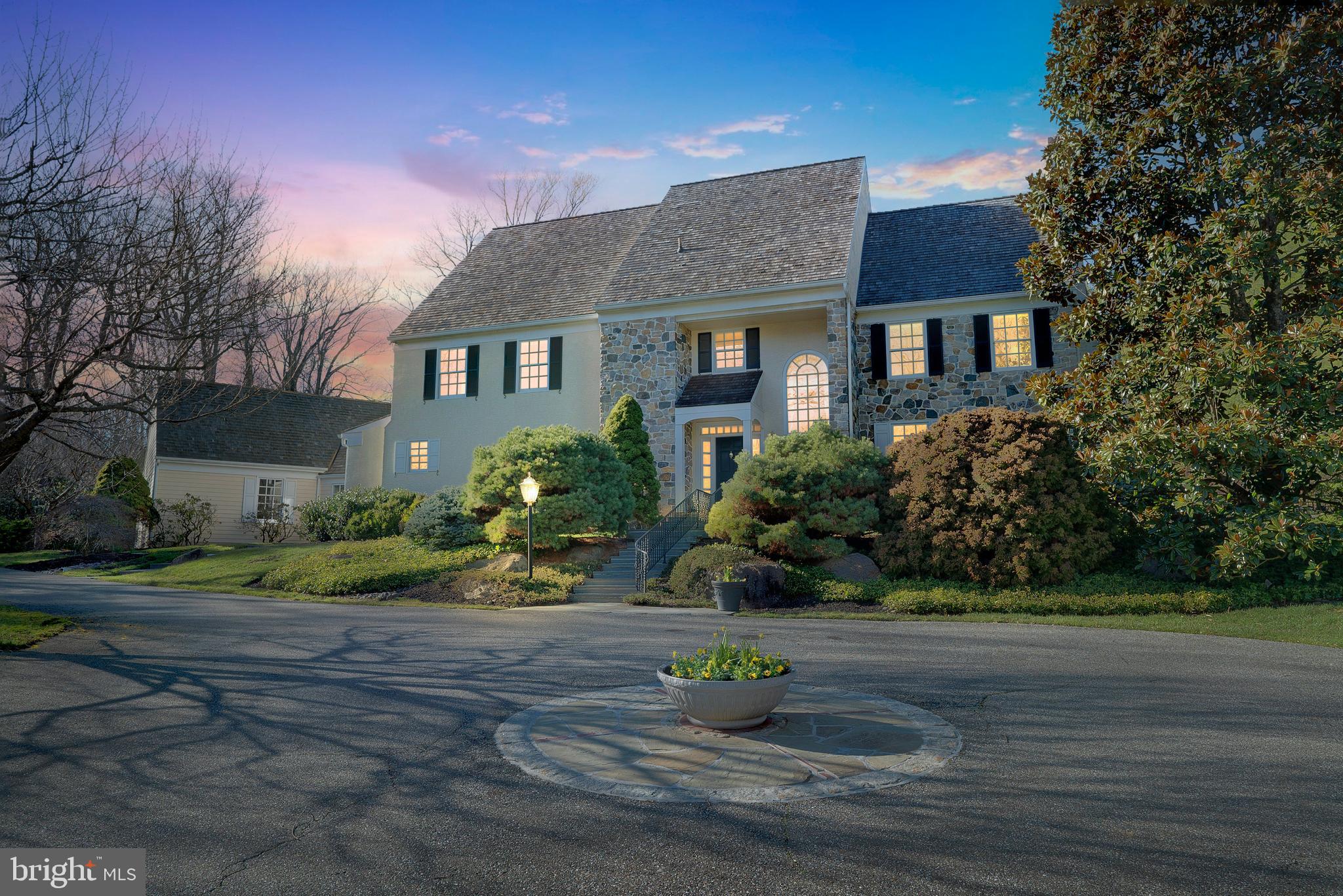 South Leopard Road has long been a coveted address in Easttown Township. A quiet street in Berwyn w/ elegant homes situated on pristine properties & yet a location that affords one an easy commute to neighboring towns, quality places to shop & dine, the Tredyffrin-Easttown Schools & surrounding Private Schools. This gracious Stone & Stucco Colonial built by George Harlan features an excellent interior design & quality that far surpasses today’s new construction. Enter the commanding Entrance Foyer w/ two closets & immediately your eyes focus on the Family Room ahead of you which boasts a stunning floor to ceiling Pennsylvania Stone Fireplace w/ raised hearth, flanked by two French Doors w/ Palladium windows that lead you to the extensive outdoor Patio. To the right of the Foyer you will find the formal Living Room w/ electric sconces on either side of the Fireplace & an adjacent Library/Den entered through French Doors which has a wall of windows to view the rear of the property & built-in cherry bookcases & extensive wood work. Between the Library & the Family Room is a Bar room complete w/ ice maker, fridge & built-in wine shelves. To the left of the Foyer is a formal Dining Room that leads to the Kitchen which is a chef’s envy & well equipped w/ all you need to create fabulous cuisine. Incorporated in the creamy white custom cabinets are Wolf double ovens & microwave, a 5 burner Dacor gas range, a warming oven, 2 Fisher & Paykel drawer dishwashers & center isand. An attached Hutch/Desk area is located beside the generous eating area. A skylighted area off the kitchen affords you a special area to relax in while having your morning coffee or tea. The kitchen flows into the Family Room & also the SunRoom w/ sliding doors all around for plenty of sunshine even on a dreary day. Both the Kitchen & the SunRoom exit to the Patio. Just off the Kitchen is a Powder Room & an open, turned stairway that leads to the partially finished/carpeted Lower Level & an abundance of unfinished Storage Space. Yet more space is off the Kitchen & that includes a Full Bath w/ Shower for pool guests, a spacious Laundry Room w/ wall ironing board & storage cabinets & closets & even a Laundry Chute, an enclosed Breezeway w/ front & rear entrances to the attached 3 Car Garage.
Continue to the 2nd floor by the Foyer turned staircase & at the top of the stairs to the right you find the Primary Bedroom w/ a marble surround fireplace, two walk-in closets w/ built-ins, a separate vanity area w/ a window for daylight & sink & then the primary bath w/ a soaking/whirlpool tub, shower & vanity. Continue down the open gallery hallway w/ views of the front Foyer & the Family Room & enter Bedroom Suite #2 w/ a wall of built in bookcases, a full bath w/ a shower & a whirlpool tub & a view of the Pool & the well maintained & beautifully planted gardens. Bedroom #3 has doors that can open to Bedroom #4. ALL bedrooms have generous walk-in closets & next to bedrooms #3 & #4 you will find a Hall Bath w/ a double vanity & oversize Shower.
There is extensive recessed lighting, high ceilings, crown molding throughout, Marvin divided light windows, Hardwood Floors throughout w/ the exception of the Tile in the Kitchen, SunRoom & bathrooms, 3 Gas Fireplaces, sprinkler system, Generac generator, central vac system & a partially circular driveway that leads to the Garage on the side of the house. There is an additional, private outdoor space off the rear Patio, on the side of the property to escape to for some quiet contemplation & it, like the Pool, has steps to take you there. From the 1st level of this exquisite, 4 Bedroom & 4.5 Bath home, you do not see the pool because it is slightly higher than the Patio, which is a very nice feature, especially when the pool is not in use during colder months. Ready to move? Settlement can be immediate so that this elegant home on 1.9 acres can be enjoyed as nature is yielding healthy & abundant Spring blossoms.