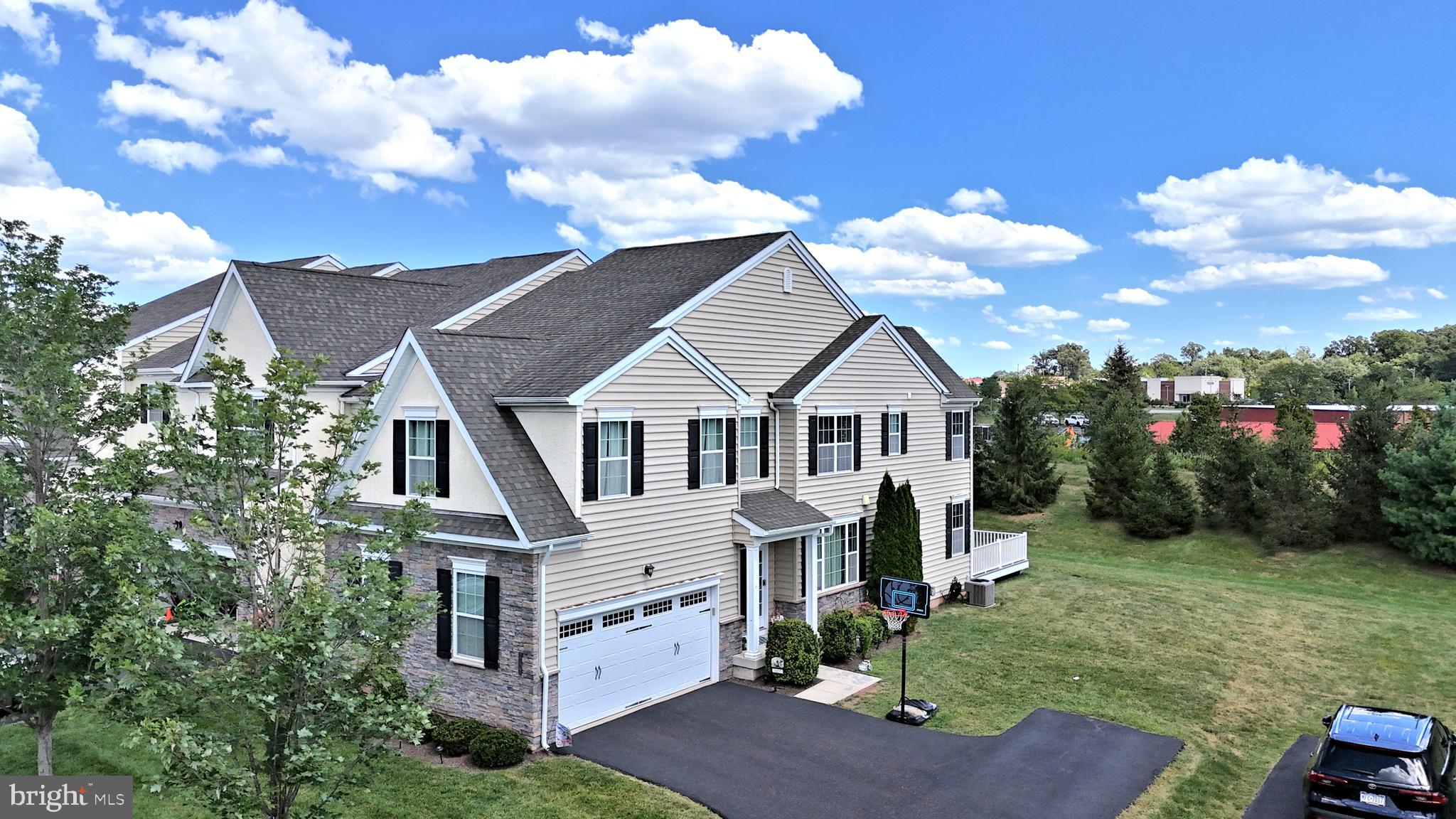 Welcome to this rarely available Dickinson model, a beautifully upgraded 4-bedroom, 3-full-bath,1 flex space/study end-unit carriage home offering over 3,000 sq ft of above-grade living space and a 2-car garage, located in the prestigious Thorndale community and served by top-rated North Penn School District.
Step inside from the charming side entry into a bright and welcoming foyer with gleaming hardwood floors , recessed lights and elegant crown molding throughout the main level. Meticulously maintained by the original owners, every detail of this home has been thoughtfully cared for.
The main floor boasts of a formal dining room, spacious family room, and a light-filled sunroom featuring a cozy propane gas fireplace. The gourmet kitchen is a chef’s dream, complete with a large granite island, granite countertops, 42” cabinetry, tile backsplash, stainless steel appliances, and a pantry. A sunny breakfast area opens to the Trex deck offering premium privacy is a rare upgrade in the community—perfect for summer entertaining and outdoor dining
.
A versatile first-floor study (used as a bedroom) and full bath offer an ideal setup for guests, a home office, or multigenerational living.
Upstairs, you'll find a spacious owner’s suite with tray ceiling, oversized walk-in closet, and a luxurious en-suite bath featuring dual vanities, a large walk-in shower, and private water closet. Three additional generously sized bedrooms, a hall bath, and a convenient upper-level laundry room complete the second floor.
The expansive basement has plenty of space, ready to be finished to your needs or used for ample storage.
Enjoy the low-maintenance lifestyle of a carriage home, with HOA covering snow removal right to your front door. All of this is situated on a premium lot within walking distance to the new shopping center, Planet Fitness, Towamencin Township Park, and scenic walking trails. Under five minutes to multiple grocery stores, shopping, fitness centers and entertainment options, Skippack Village, the PA Turnpike, Montgomery Mall, Wegmans, Costco, and major employers like Merck. Quick access to SEPTA’s R5 line offers easy commuting to Philadelphia and Center City.
This exceptional home offers the space of a single-family residence with the convenience of community living. Don’t miss your chance to make this move-in-ready dream home yours!