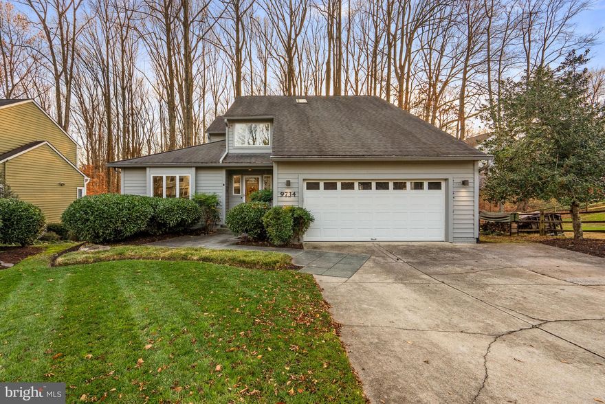 Beautifully updated transitional residence offering 4 bedrooms, 3.5 bathrooms, and 3,492 square feet in desirable Kings Contrivance. Thoughtful front landscaping and a paved walkway welcome you inside, where hardwood floors flow throughout the bright and airy main level. The 2-story foyer opens to a sun-filled formal living room and a spacious formal dining room. Recently remodeled in 2025, the impressive bright-white eat-in kitchen features stainless steel appliances, a pantry, generous cabinet and counter space, and a charming breakfast room—perfect for casual dining. Off the breakfast room is an expansive family room featuring a cozy wood stove, a convenient powder room, and access to the stunning screened porch with vaulted ceilings and skylights. Upstairs, a lofted landing provides the ideal space for a reading nook and features a walk-in closet for added storage. This level also features two full bathrooms and three carpeted bedrooms, including the primary suite with cathedral ceilings, a private balcony, and an updated en-suite bathroom with skylights, dual sinks, and a soaking tub. The lower level provides even more living space, offering a recreation room, a full bathroom updated in 2025, a laundry closet, a fourth bedroom, walk-out access to a covered patio, and plenty of storage. Outdoor living shines with a low-maintenance deck just off the screened porch, with stairs that lead to a covered patio below. Both spaces overlook a serene backyard backed by tranquil, wooded views. Additional features include an attached two-car garage equipped with a Gladiator® storage system and attic access for extra convenience.