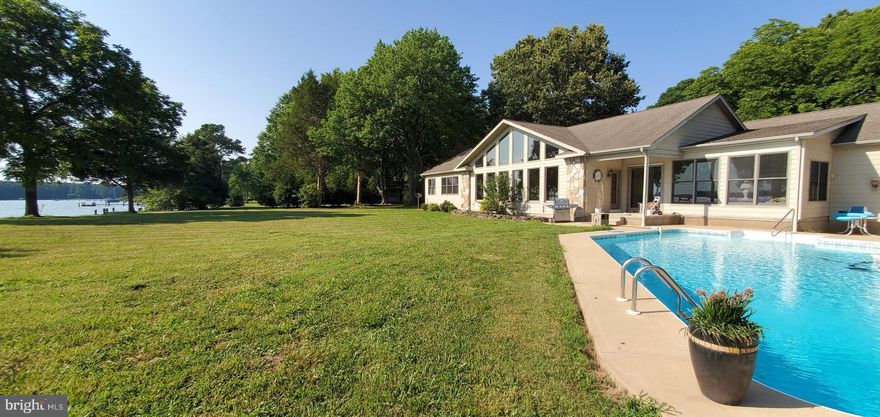 Vacation every day in your own back yard! Offering a private boat dock, pier, boat lift, and inground pool. Come in from the pool and relax in the sunroom that overlooks the beautiful views of Edge Creek.  With the 3 car garage you will have ample space to keep all your toys. Roughly 3,000 square foot, open floor plan featuring a designer chefs kitchen with granite counter tops and large island.  Unique floor plan for entertaining overnight guests.  With just a short drive to the quaint town of Saint Michaels!