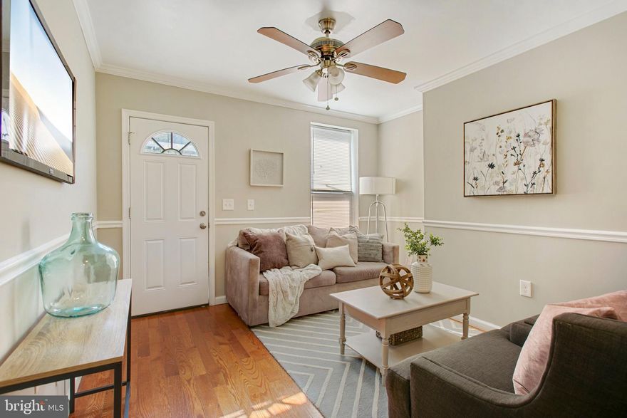 **Highly Motivated  Seller**Make an offer! This home it’s beautifully updated with wooden floors and a new custom trim and paint package. The first level has a spacious living area with a half bathroom nestled between the kitchen and living room. On the rear of the kitchen there is a spacious mudroom that one could use as an office and a back patio that leads right off of the spare room off of the kitchen. The second level has two large bedrooms with one full bathroom and the third level consists of one large bedroom with one full bathroom. The basement is large and has a high ceiling height so one can use it for a workout room or storage. Located close to Hopkins Hospital this property is convenient for city living. The Target and Harris Teeter Shopping Center is only a 5 minute drive away so that one can conveniently shop and dine.