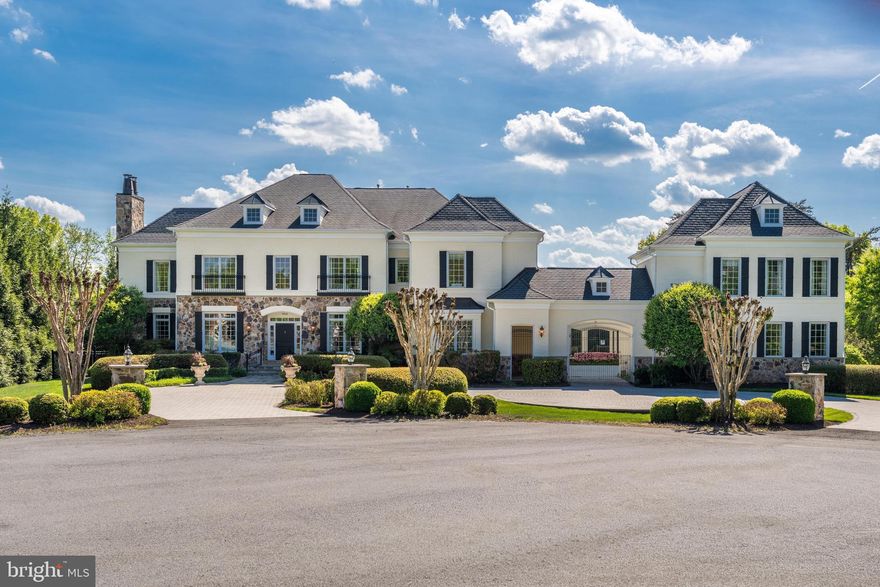 Welcome to light-filled 9113 Dara Lane, a distinguished estate featuring an incredible separate guest house, ideally located in the prestigious Great Falls community at the end of a quiet, spacious cul-de-sac just minutes from everything!  Situated within a highly rated school pyramid and offering exceptional convenience to Tysons Corner’s premier dining and shopping—including Neiman Marcus—this home perfectly balances privacy with accessibility.

This exquisite residence offers approximately 12,100 square feet of refined living spaces, with 7 bedrooms and 8 bathrooms designed for both grand entertaining and comfortable everyday living. A grand foyer welcomes you and sets the tone for the elegance found throughout. The main level showcases a sophisticated living room, formal dining room, and stately library, all enhanced by timeless architectural details and high-end finishes.

The gourmet kitchen is a chef’s dream, featuring top-of-the-line appliances, custom cabinetry, and an expansive island—ideal for both culinary creations and gathering with guests. Throughout the home, a seamless blend of old-world charm and modern conveniences creates a warm yet luxurious atmosphere.

The primary suite serves as a private retreat, complete with a sitting area and a lavish en-suite bath. Additional bedrooms are generously sized, offering comfort and privacy for family and guests alike.

Perfectly sited on just under 2 acres,  the outdoor spaces provide a serene and private oasis with lush landscaping and ample room for entertaining or relaxing. From quiet mornings on the patio to hosting gatherings, the grounds are designed to elevate everyday living.

This exceptional property presents a rare opportunity to experience timeless elegance, modern comfort, and unmatched convenience in one of Great Falls’ most sought-after locations.