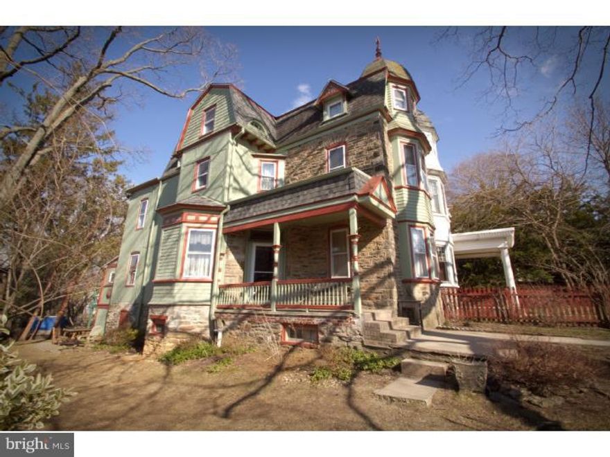 Feels like home! This sunny 5 bedroom, 2 full bath Victorian twin is warm and inviting. Lovely classic details like high ceilings, two decorative fireplaces with mantles, and hard wood floors are complimented by modern updates. Remodeled open kitchen/dining room with radiant heated floor, au courant concrete counters, and center island/bar. New second floor hall bath has radiant heated floor and stall shower. New third floor bath features large soaking tub and tile floor. Wonderful fenced yard with well tended garden beds is great for outdoor play and entertaining. Great location--walk to both R7 and R8 trains, library, playground and ball field, grocery, and shops and restaurants on Germantown Ave.