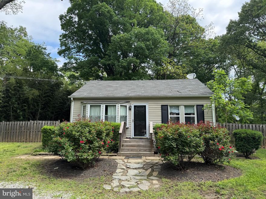 Charming cottage on large lot conveniently located to Route 1, Fort Belvoir, and Quantico.  Three bedrooms plus 2 full baths.  Large deck off the back of the house.  Nice kitchen.  Backs to Parkland.  Wood floors and Berber carpet in bedrooms.  No HOA.  Newer roof, AC and  plumbing.  City water and sewer.  Off street parking for multiple vehicles.  Available June 1o a few days before. Shown by appointment with current tenant.  Dog will be caged.  Usually available after 4 pm each day.