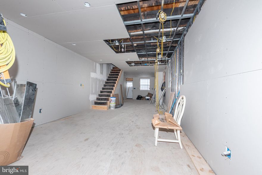 EXCELLENT OPPORTUNITY TO FINISH THIS PORCH FRONT HOME WITH THE POSSIBILITY FOR 3 FINISHED LEVELS!  Property is about 70% finished and needs someone to come in and finish the renovation.  Currently framed out with an open floor plan on the main level, upper level with 3 bedrooms and 2 full baths, and potential to finish the basement with an additional bathroom to add more living space, and has a new roof!   Sold As-Is!