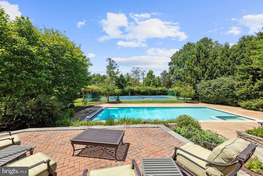Start checking the boxes...this one has it all!!  A pool AND tennis court, a home office AND a separate in-law/2nd home office suite, FOUR car garage, private cul-de-sac setting close to Potomac Village & Montgomery Mall/I-270/I-495!!  Beautifully maintained/renovated/updated, 6,200+SF colonial with a  porte-cochere, circular drive, beautiful, level usable 2+acres.  Great natural light and generously proportioned room sizes with a terrific circular floor plan for large scale entertaining.  Formal Living Room and a Dining Room to seat 12+; dramatic vaulted ceiling Family Room with sitting nook, separate Library, renovated Kitchen with professional grade range, stainless steel appliances,  center island, loads of storage, too!!   The coveted separate 2 car garage includes an In-Law/Au Pair Suite/Studio with a full bath.  How great is that for an escape during a pandemic ??!!  Outside you will find a gardener's delight with many specimen trees and plantings, perfect sunlight for a flower or vegetable garden.  Relax and rest on the comfortable screen porch with cross breeze ventilation -- you won't want to leave!  Entertain family and friends - with social distancing - on the tennis court or poolside.   There's plenty of room to kick back and relax!  Come find your paradise today!!  It's here!