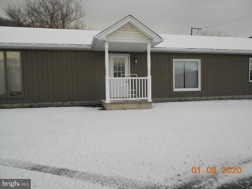 Large office/professional building.  3 rooms (2 large) with large storage area with garage door entrance for equipment.  Additional loft area for storage.,Large office space for 4 or 5 desks.  A smaller private office and a large conference-type room.