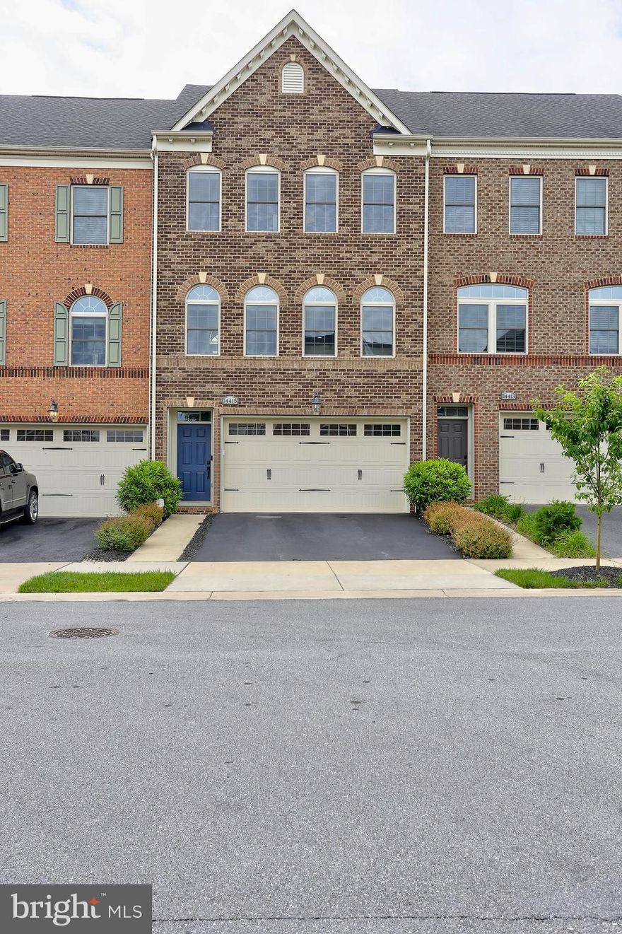 Welcome home to 14415 Cannock Chase! This stunning modern townhome boasts three spacious bedrooms, 2 car garage, three and a half baths, an enormous lower level with walk out to the exterior along with a huge space that can serve as a movie theater, play area and so much more. Head in and tour this absolute stunner of a home. This home offers a perfect blend of contemporary design and luxurious comfort. The modern open kitchen features sleek stainless-steel appliances, endless granite countertops, a convection oven/microwave, complemented by a massive island that serves as the centerpiece for culinary creativity and social gatherings. Do not forget to take a look at your walk in (YES WALK IN) pantry. The gleaming floors will wow you with each step heading to and from the dining and living room! Each bedroom is generously sized, providing ample space for relaxation. Open the door to your large primary bedroom, where you will see, not 1 but 2 walk in closets, a double vanity and large double headed shower. On your way back down be sure to take a look at the modern washer & dryer conveniently located on the top level with the bedrooms! The large deck is ideal for outdoor entertaining, while the two-car attached garage offers convenience and security. Cutting-edge technology enhances the home's functionality, with a Kwikset Halo biometric fingerprint front door lock, Ecobee smart thermostat, and MyQ mobile phone garage door system. Energy-efficient LED bulbs illuminate every room. Located with direct access to Fairland Regional Park, residents can enjoy nearby hiking and biking trails, as well as the amenities of the Fairland Sports and Aquatic Complex. Conveniently located close to all major highways including 95, 200, 29 and 198 and minutes from grocery stores, restaurants and so much more.