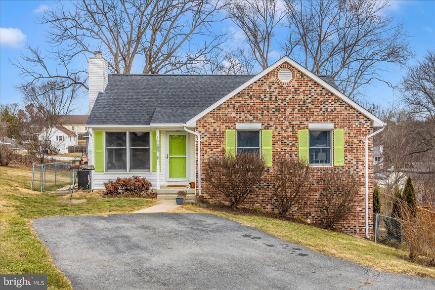 Welcome home to this move-in ready brick-front rancher tucked away on a quiet dead-end street. Step inside to a bright living room anchored by a cozy gas fireplace, flowing seamlessly into the dining area and updated kitchen featuring sleek backsplash, stainless steel appliances, and durable luxury vinyl plank flooring.  Three comfortable bedrooms with ceiling fans and plush carpeting share a full hall bath, offering easy one-level living. The finished lower level expands your living space with a spacious recreation room, full bath, office, kitchenette and laundry room with walk-out access to a private back patio—perfect for guests, hobbies, or relaxing evenings.  Enjoy outdoor living on the expansive deck overlooking the fenced backyard, ideal for entertaining or unwinding in peace. Conveniently located near shopping, dining, the local library just three blocks away, and major commuter routes and MARC Train, with no HOA and priced as one of the most affordable single-family homes in the area—this one checks all the boxes. Better see it soon.