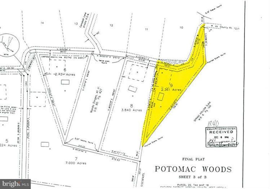 Wooded Lot  -  2.361 wooded acres adjoined by a wet weather stream.  Located west of Great Cacapon with county road frontage. County approved septic permit.  Make your dreams come true with this lot.