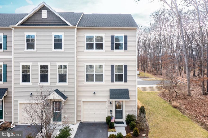 Exquisite end unit town home now available. Completely move-in ready and in excellent condition, this home has lots of  upgrades! Nestled at the end of a cul-de-sac and next to a large wooded lot, you are just a short walk to all the amenities Snowden Bridge has to offer. As you enter the home, you will notice the addition of board and batton, shiplap, hardwood floors, upgraded tile work and impeccably maintained carpet. This town home has an 8 foot extension off the back of the home, making it feel large and spacious. Being an end unit, there is the addition of more windows and ample light. The kitchen and living room have hardwood floors throughout, stainless steel appliances, granite countertops, a large island and room for a table. Off the kitchen, a large deck is perfect for relaxing or entertaining. Upstairs, the large primary suite has trey ceilings, an attached en suite with upgraded tile floors, a double sink, powder room and large tile shower and a huge walk-in closet. Two other bedrooms, a large linen closet, second full bath and washer/dryer upstairs make everyday life easy. The lower level is completely finished with a large family room and half bath. A patio off the finished space and fully fenced yard are perfect for small children to play in or for hosting backyard barbecues. The community is close to all major commuter routes, shops, restaurants, Starbucks and Target! It features a large outdoor pool, a daycare center, plenty of walking/jogging trails, a playground, indoor courts and a community center. This stunning home with all the upgrades shows like a new build but without the wait time, a close proximity to the front entrance and with the tasteful upgrades you want! Come and take a look for yourself! You will love it!