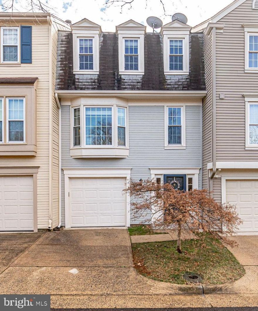 Check out this beautiful 3-level townhouse with one car garage. The first floor has a huge welcoming foyer with plentiful coat closet and access to the garage. The garage has extra overhead storage and a second refrigerator. On the entry level there is a large family room (could be used as 3rd bedroom?), stacked washer and dryer installed in 2019. One level up you will find a bay window that makes for a bright living area with hardwood flooring & a wood burning fireplace. The kitchen has stainless steel appliances, a brand new stove was installed last week!, breakfast bar, granite counter tops. There is a separate dining area with a sliding glass door to the large freshly painted deck..so great for entertaining. The deck has steps to the fenced rear yard and direct access to the open community space. There is a convenient powder room on this level. On the top floor are 2 very large bedrooms both with ensuite baths. The bedroom at the rear of the property has two skylights with shades and there is a skylight in the bathroom. The front bedroom also has a skylight. The HVAC was replaced in 2017. This home is in a super convenient location with easy access commuting to Arlington, DC! You'll like it, come and see.