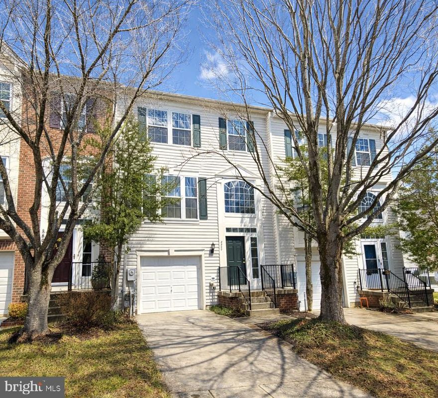 Welcome to 8800 Stonehouse Drive, a garage townhome ideally located in Ellicott City with great access to major commuter routes, parks and top ranked schools! This home has fresh paint and new carpet throughout and is ready for immediate occupancy. The open concept floor plan with a three level bump-out is versatile and offers all the right spaces. Entertain in the living room and formal dining area, both featuring 9' ceilings. The kitchen offers hardwood flooring, on trend white cabinetry, granite countertops and a new gas range in 2023.  Enjoy morning coffee in the sunny breakfast area or relax in the casual living space adjoining the kitchen. The upper level features three bedrooms and two full bathrooms.  The large primary bedroom suite has vaulted ceilings, a bump-out with a sitting area, a custom walk-in closet and access to a private full bath with double sink/vanity, separate shower and soaking tub. The finished lower level offers a large recreation space with a cozy gas fireplace, a bump-out, ideal for home office, gym, or play area and a rough in for a future bathroom. The relaxing deck and lower patio overlook open space and trees. This home features economical natural gas heat and offers great mechanical updates including a new roof in 2022 with transferable warranties, washer in 2022, AC in 2021, water heater in 2021 and natural gas furnace in 2018. Great community with very low HOA fees!