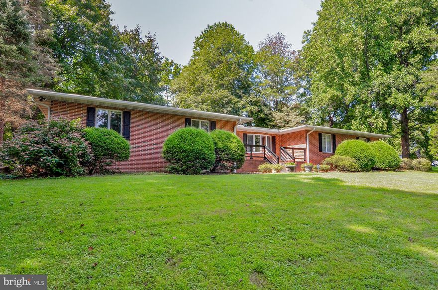 Incredible custom all-brick rancher!  Located on a private, serene 1.77 acre corner lot in Kingsville!  You will be greeted with mature trees, extensive landscaping and lush lawn along a long paved driveway ending with a circular drive and two car side-load garage.  Features open front porch with flagstone and copper railings.  Paver walkway to a garden patio complete with exterior kitchen, trellis, waterfall with koi pond and firebowls!  An oasis perfect for entertaining and dining!  Inside the home, there is a large entry foyer with very spacious office to the right.  Office features built-in bookshelves, bar & lighting.  To the left, there are three guest bedrooms and a recently remodeled full bath.  Down the hall to the large primary bedroom with multiple closets, en suite bath with jetted tub, separate shower and double vanity.  Also on the main level is a very open country kitchen with large breakfast bar, plenty of cabinet space, 6-burner downdraft cooktop, breakfast nook & large walk-in pantry.  Doors off kitchen to rear patio.  Also features great room with wood burning fireplace, mantle & natural stone hearth & wall.  Spacious laundry/mud room with nearby full bath and access to the back hallway leading to the garage and lower level.  Features almost 3500 sqft. just on the main level.  Lower level has multiple finished areas and space for two additional rooms.  Currently set up with family room with wood burning fireplace, a kitchenette (no stove), separate bedroom with closet, home gym and full bathroom.  Ideal guest suite or in-law apartment.  Over 1500 finished sqft. on this level with space for more.  Two large unfinished rooms could be used for larger home office, media room, woodworking, music etc.  Very ideal property for home-based business or contractor.  Two zone hvac, two water heaters and central vac throughout house.  Many additional items included for buyers like air compressor (with line to basement & garage), four kitchen bar stools, some gym equipment,  pool table, all appliances in the main kitchen, lower kitchenette & outdoor kitchen, front load washer & all window treatments.