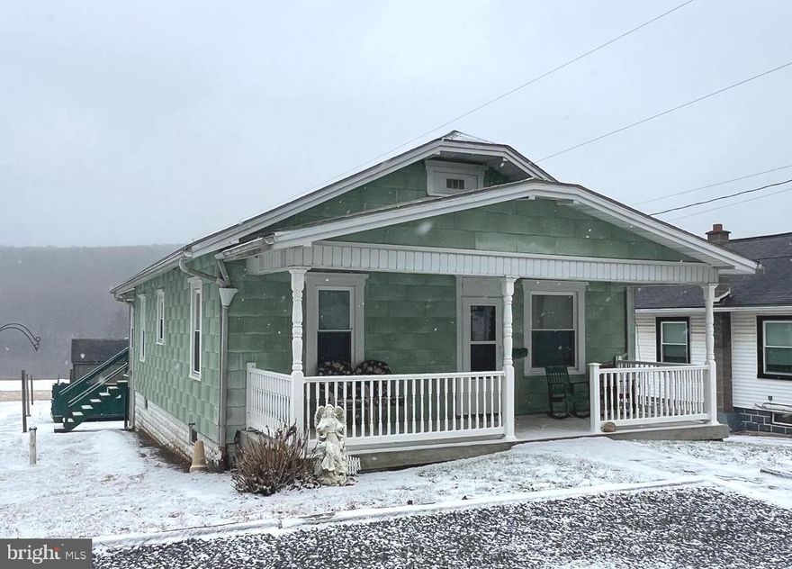 Bungalow/Ranch home with front and back porches to take advantage of the amazing views of the mountain and field.  Back deck has room for a table and chair set for enjoying that first morning beverage or last evening one.  Enter into the mud/laundry room on the back of the home with access into the kitchen which features oak cabinetry and plenty of storage.  Optional dining room or use as a flex space which leads into the living room.  2 spacious bedrooms with a conveniently located bath between them.  Bathroom was recently remodeled.  Full basement for storage or bring your finishing ideas.  Walk out basement to storage area under the deck and shed.