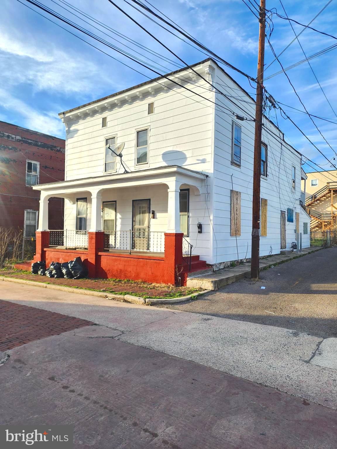 INVESTOR ALERT! This triplex is a fantastic investment opportunity, featuring three units—a one-bedroom, a two-bedroom, and a three-bedroom. Some renovations have already been completed in the left unit, while the other two units are in need of a full rehab, offering great potential for added value. The property boasts a front porch, three rear porches, and a fenced-in backyard, providing ample outdoor space. Conveniently located close to downtown Cumberland, this triplex is just minutes from shops, restaurants, and entertainment. Priced to sell, this is a deal you don’t want to miss! Call today for more details!