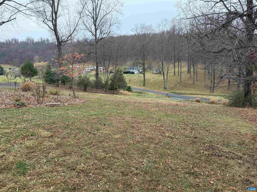 Great 3 acre lot in Albemarle County. Only 4 minutes from Pantops. This lot is located between homes 413 and 437 Rocky Hollow Rd.