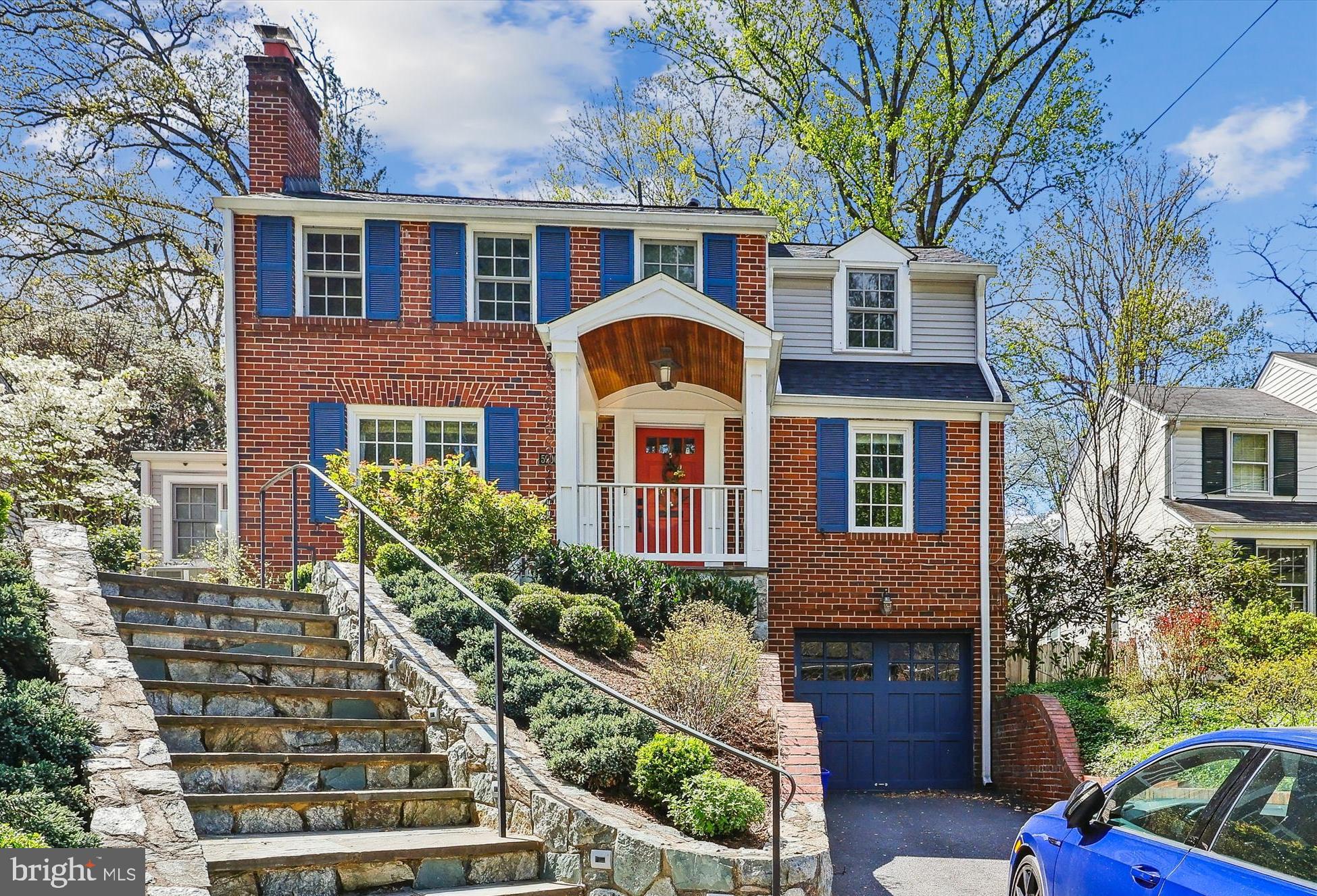 This is your chance to own a home in Bethesda’s sought-after Woodacres neighborhood. This classic colonial home exudes charm and elegance on a beautifully manicured lot. With 4 bedrooms, 2 full baths, and 1 half bath, this residence offers a generous 2,391 square feet of living space above ground. As you step inside, you are greeted by stunning hardwood floors that flow seamlessly throughout the home. The living room features a cozy fireplace, perfect for chilly evenings, while the spacious den boasts built-in shelving, ideal for displaying your favorite books and decor.
The heart of the home is the fabulous renovated eat-in kitchen, which is a chef’s dream. It features an abundance of cabinets, gleaming stainless steel appliances, and a kitchen island that provides ample space for meal preparation and casual dining. The kitchen opens beautifully into a brilliant sunroom, a bright and airy space where you can relax and enjoy the view of the lush backyard. Adjacent to the kitchen is a spacious dining room, perfect for hosting dinner parties.
The current home office is situated in a second sun room, conveniently located off the dining room. It provides another quiet space for work, study, or exercise. Step outside to the back patio, where you can unwind and enjoy the serene surroundings of the meticulously landscaped yard. Upstairs, the spacious primary bedroom features an en-suite bath, providing a private retreat. Three additional sun-filled bedrooms and a second full bath complete the upper level.
The one-car garage provides direct access to the finished basement, which includes a laundry area and a workshop closet, offering plenty of storage and functionality. This home is a true gem in one of Bethesda’s most desired neighborhoods. Come and experience the beauty and tranquility of Woodacres for yourself.