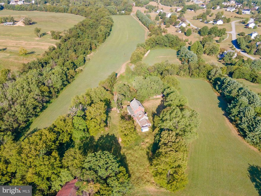 Offers due Friday 9-19-25, 5:00pm. Nestled on just over 30 acres of lush, green farmland, this exceptional property offers an all-brick Colonial that with your vision and love is a home to exude timeless elegance with spacious living areas and traditional features.
Explore the expansive grounds to find the impressive bank barn with stone foundation, fields that provide for hay production, a brick smoke house and a run-in shed all in need of love. 

Whether you are seeking a peaceful retreat or a farmstead, this property has the potential to offer a harmonious balance of natural beauty and historic charm. Bring your vision to renovate this beauty back to its glory! Property is an Estate and being sold AS-IS! Please do not drive onto the property, appointment and Hold Harmless waiver required to view.  Schedule your appointment today to view the potential that awaits.