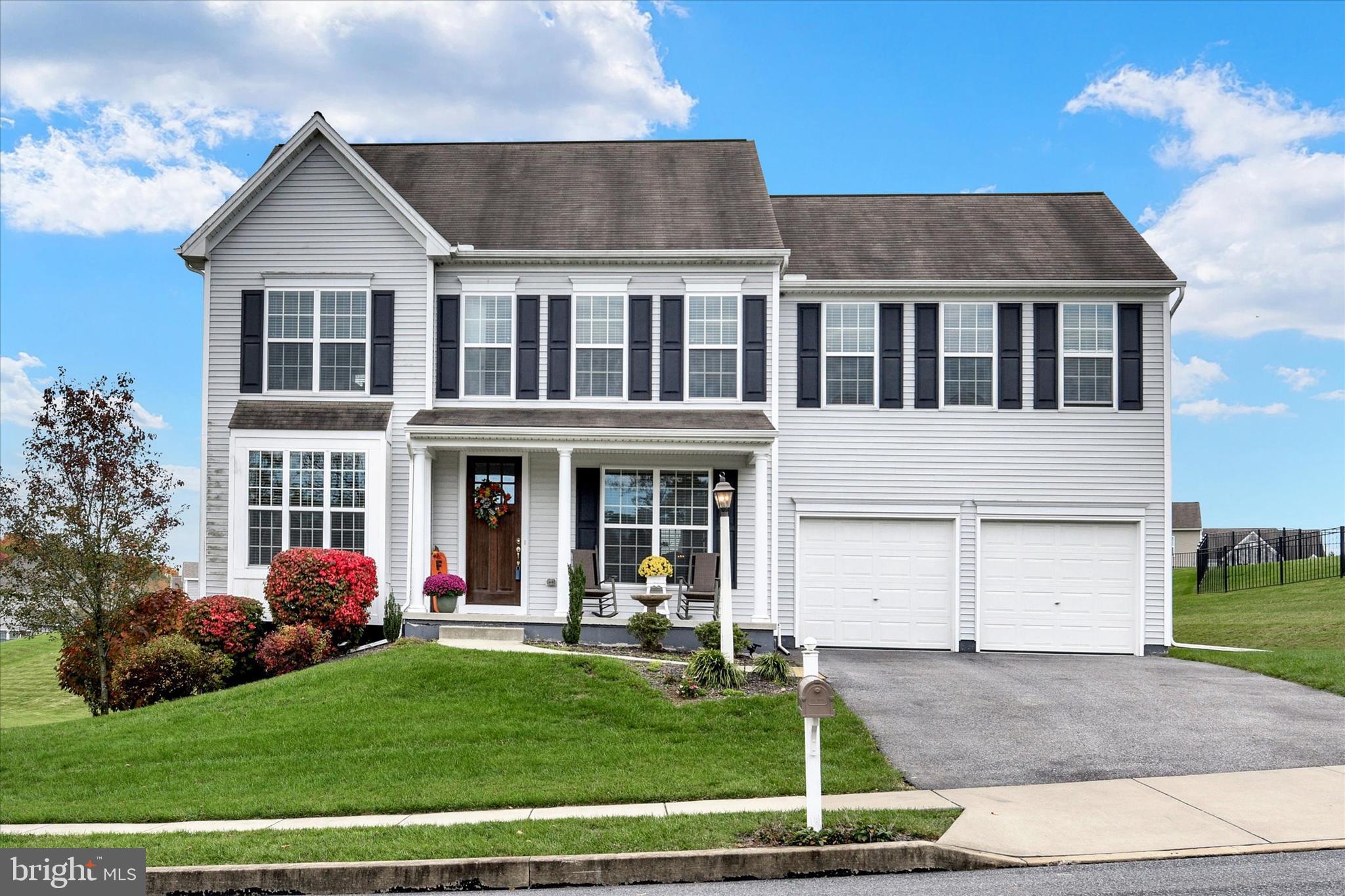 Welcome to this exquisite residence nestled on almost a half an acre lot within the sought after Spring Hill community! You’ll be immediately captivated by the charming curb appeal and the inviting covered front porch, an ideal spot to savor your morning coffee. Boasting over 3,127 square feet of meticulously finished living space, this home features an open floor plan highlighted by rich hardwood flooring and recessed lighting throughout the main level. As you step inside, you’ll discover the welcoming foyer with the living room on your left and an elegant formal dining space adorned with tray ceiling on your right, a perfect space for hosting gatherings. The stylish kitchen features a spacious island with bar seating, granite countertops, stainless steel appliances, double ovens, chic tile backsplash, pantry for storage and a charming breakfast nook with convenient outdoor access. Open from the kitchen is the cozy family room complemented by a gas fireplace. Main level laundry room and half bath. Head upstairs to find the versatile loft area, perfect for additional living space, office or playroom. Second level includes four generously sized bedrooms. Primary bedroom includes plush carpeting, window treatments, recessed lighting, a walk-in closet and a luxurious full bath with tile floors, soaking tub, double vanity and tiled shower. An additional full bath with a double vanity is centrally located in the upstairs hallway. Make your way to the finished basement, where a media room provides an excellent entertainment space. Two car garage. Conveniently situated near a neighborhood park, shopping, dining and entertainment. A joy to own!