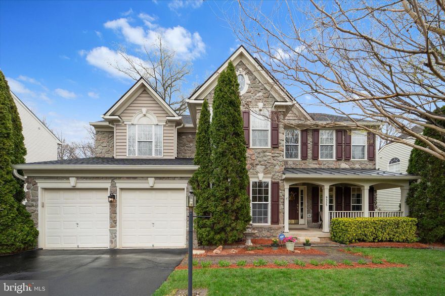 Welcome to 9325 Rustic Breeze Drive, a stunning Vanderbilt model by Richmond American Homes tucked away on a quiet cul-de-sac in the sought-after Crossman Creek community in Bristow. This exceptional home offers 6 bedrooms  and 4 full bathrooms, providing ample space for comfortable living and effortless entertaining. From the moment you arrive, you’ll be captivated by the home’s charming stone front and inviting covered porch. Step inside to a grand two-story foyer that sets the tone for the spacious and light-filled interior. The main level features a large formal dining room, a versatile living room or home office, a main-level bedroom with a full bath, and a convenient designated laundry room, all accented by beautiful and molding and hardwood floors. The heart of the home is the impressive family room, complete with a coffered ceiling, cozy gas fireplace, and walls of windows overlooking the private backyard. The open-concept kitchen is designed for both function and style, featuring cherry cabinetry, a large walk-in pantry, desk area, Butler’s pantry, hardwood floors, and abundant natural light streaming through dual windows above the sink.
Upstairs, retreat to the luxurious primary suite, showcasing a tray ceiling, a relaxing sitting area with its own double-sided fireplace, and a spa-like en-suite bath with a corner soaking tub, dual vanities, and a separate water closet. Additional bedrooms are generously sized, offering flexibility for family and guests.
Step outside to your fully fenced private backyard, perfect for entertaining or unwinding, with multiple outdoor living spaces including a deck and ground-level patio.
All of this plus an unfinished walk-out basement, ready for your custom vision—whether it’s a home theater, gym, or additional living space. Conveniently located near shopping, dining, commuter routes, and top-rated schools, this home truly has it all. Don’t miss your chance to own this incredible property in one of Bristow’s most desirable communities! Roof & Gutters 2021, Shutters 2025, Exterior and Interior Painting 2025, 50amp outlet installed in garage 2023, Hot Water Heater 2022. Dishwasher 2019, Refrigerator 2020, Garbage Disposal 2025.