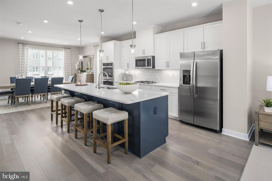 THIS FEBUARY DELIVERY HOME WILL INCLUDE :Upgraded Elevation C ,Monroe Designer Interior Package, Quartz Iced White Countertops, Stainless Appliances with Gas Cooking, LVP Flooring on the Main Level, Ceramic Bathrooms, Ceramic Laundry Room, 3-Piece Plumbing Rough-In, 18'x8' Composite Deck, Additional Lighting, Smart Thermostat, Wifi Garage Door Opener, Tankless Hot Water Heater in the Kitchen, and so much more ! The Schubert, at the largest of the Composer II series homes, offers the space and customizing details of single-family living with the convenience of a townhome. On the main living level, you're greeted by an enormous and airy kitchen with a huge island perfect for entertaining. The dining room provides space for a more formal meal while the great room is perfect for movie night evenings at home. Up a flight of stairs designed to be elegant and functional, the upper level boasts three bedrooms, two baths, and a full sized 2nd floor laundry with extra shelf space and an optional laundry tub. No need to worry about storage space Ã generous closets abound in both bedrooms. The Primary's Bedroom is a private retreat accented with an optional tray ceiling and featuring an enormous walk-in closet. The Primary's Bath boasts a soaking tub and separate shower with seat and a dual vanity for the ultimate in convenience. Several lower level floor plans are available depending on community. Photos are Representative. Lot Premiums may apply.