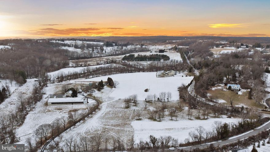 ESSENCE
Live authentically. Belfast Manor, Circa 1818. Timeless stone estate set within the rolling pastures of Sparks within the glorious Western Run Valley, spanning over two parcels for a total of 57.504 acres. Authentic  architectural details intact. Exposed beams punctuate this classic homestead. A luminous glass sunroom extends the seasons. Splash in the shimmering saltwater pool as days melt into evening light. Expansive covered arena with a stone fireplace and concrete floor. An open air party barn like you've never experienced, ripe with potential. Outbuildings include a storied bank barn with two apartments, a spring house, grainery, and two run-in sheds. Embrace the country lifestyle. Xfinity internet. The art of uniting human and home. Cultivate your existence.

LOCAL FLAVOR AND PROVISIONS
John Brown Store and Wegmans. Favorite local dining atThe Milton Inn, The Oregon Grill, The Butler Cabin, and The Filling Station. An exit north offers Graul's Market along with Casa Mia’s, Manor Tavern, The Fill'Er-Up, The Yellow Barn, Woodfire Kitchen and The Creamery Connection. Tap into local breweries, such as Inverness Brewing, Farmacy Brewing and Big Truck Farm Brewery.

OUTINGS AND LEISURES
Explore the NCR Trail. A 21-mile flat, crushed-stone trail open to hikers, bikers, and horses, it runs along the scenic Gunpowder Falls river. Minutes to Prettyboy Reservoir. This area is open to hiking, rowing, or paddle boating, bird watching, horseback riding and nature photography year-round, and for archery hunting during a regulated season. Go tubing on the Gunpowder River. Enjoy Ladew Topiary Gardens... these gardens are 22 acres of spectacular, award-winning gardens, more than 100 remarkable topiaries, a mile-long Nature Walk, and native Butterfly House. Explore The Manor Mill, a pre-revolutionary grist mill that now houses a wide variety of art and entertainment events. Tee off at Greystone Golf Course in White Hall. Or visit The National Lacrosse Hall of Fame and Museum which honors the history and legends in the sport. 

PROXIMITY
Zippy access to the I-83 on ramp, about 8 minutes to Hunt Valley, and about 18 minutes to Towson. 45 minutes to BWI and 23 minutes to Penn Station.

REGION
Sparks Glencoe is known for its scenic rural landscape, and historic charm. The original 1916 Sparks State Bank now serves as a Nature Center.