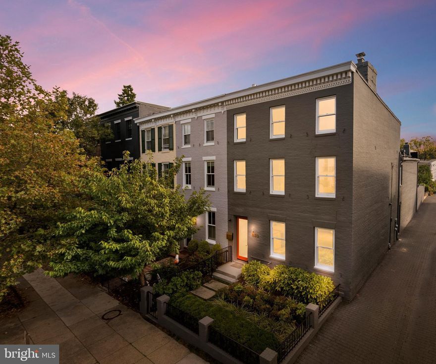 Behind the handsome 19th-century facade, a premier residence filled with space, light, and cubic volume awaits in a sophisticated contemporary retreat shaped by the owners' vision and KUBE Architecture (Forbes "Best In-State Architecture Firm" 2025). This transformation is infused with functional and purposeful design resulting in soaring spaces to entertain and more intimate ones to comfortably relax. At 20' wide and with over 3,000 sq ft of indoor and outdoor rooms, this exceptional property lives and entertains graciously whatever the occasion.

The outdoor spaces are masterfully merged with the interior via a remarkable expanse of south-facing glass. Steel beams are tempered by natural wood and recycled and repurposed building elements. The architectural lines create a dramatic sense of airiness, opening the outside to the inside with the slide of the glass walls.

The chef's kitchen is the heart and centerpiece of the house and flows easily to the large living and dining spaces both inside and out. Sustainable Pedini cabinetry and high-end appliance package offer clean lines and surprising amounts of storage for just about everything.

Three flexible finished floors feature multiple living areas and 3-4 bedrooms anchored by warm wood flooring, bright expanses of glass, and clever storage. Just about every square foot has been thoughtfully planned and executed. A passenger elevator helps you age in place. Additional storage and systems basement with two standing wine coolers. Professionally landscaped and maintained patio and gardens with sprinkler system. Separately deeded garage conveys.

633 E Street is located in the Eastern Market/Barracks Row diner's paradise. The list of what's close by says it all, from Michelin stars to casual pubs. This art-lover's showplace is an important, one-of-a-kind property in the heart of Historic Capitol Hill.