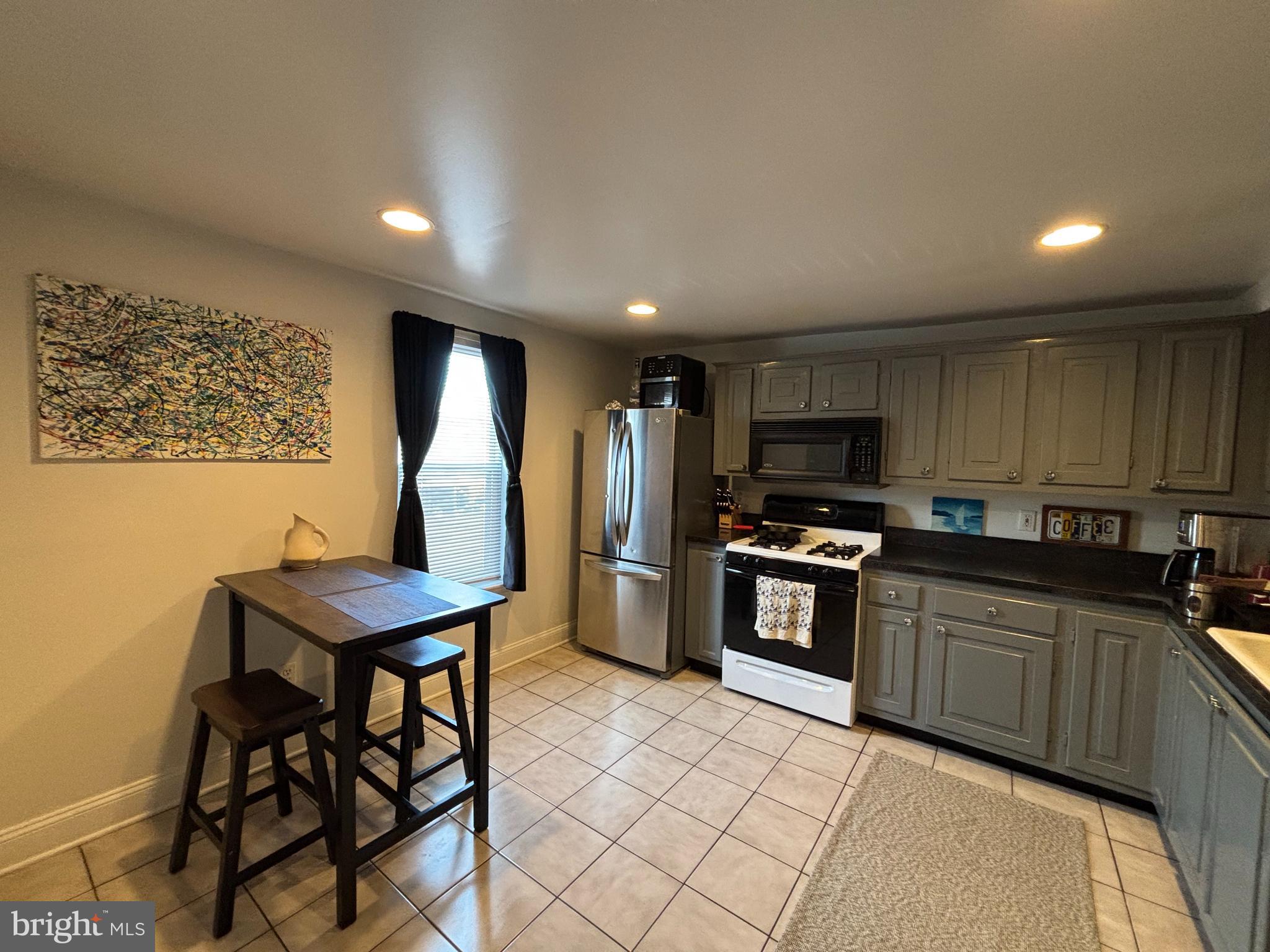 Best deal in Locust Point!!! This two-story apartment features 3 extra large bedrooms and 2 full bathrooms with 2 CAR PARKING AVAILABLE. Newly renovated first and second-floor bathrooms, exposed brick throughout, CAC, modern large eat-in kitchen, dishwasher, microwave, W/W carpeting, and stack front loading washer/dryer in unit. The unit is nearly 1500 sq ft, has been freshly painted, and new carpeting added. The option for 2 CAR PARKING spaces that can be rented for an additional $100/month if interested!!! This property is in the heart of Locust Point and provides easy access to all the city living features you love!!. Latrobe Park is 2 blocks away, and you can walk to restaurants, bars, Under Amour, Ft McHenry, Charm City Circulator & Commuter Water Taxi, Federal Hill, and Harris Teeter shopping center, all close by! I'm sorry that pets/smoking are not allowed. Max of 3 occupants for this unit